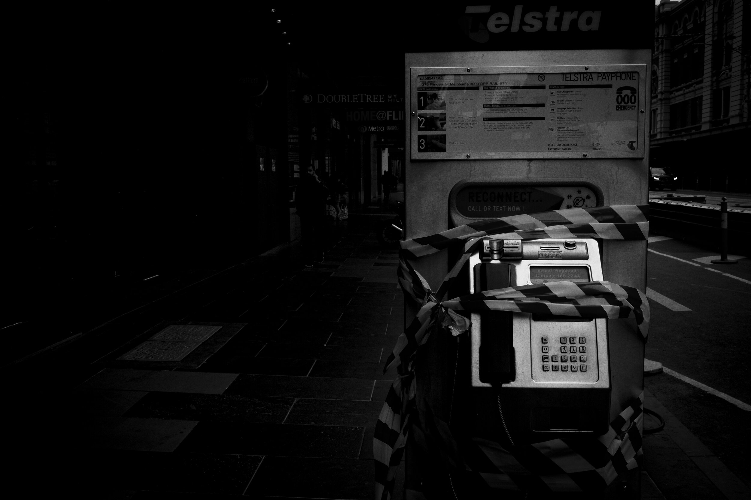  18/04/20 15:07pm Flinders Street, Melbourne. To ease the spread of the virus, objects of public use have been haphazardly taped off.  