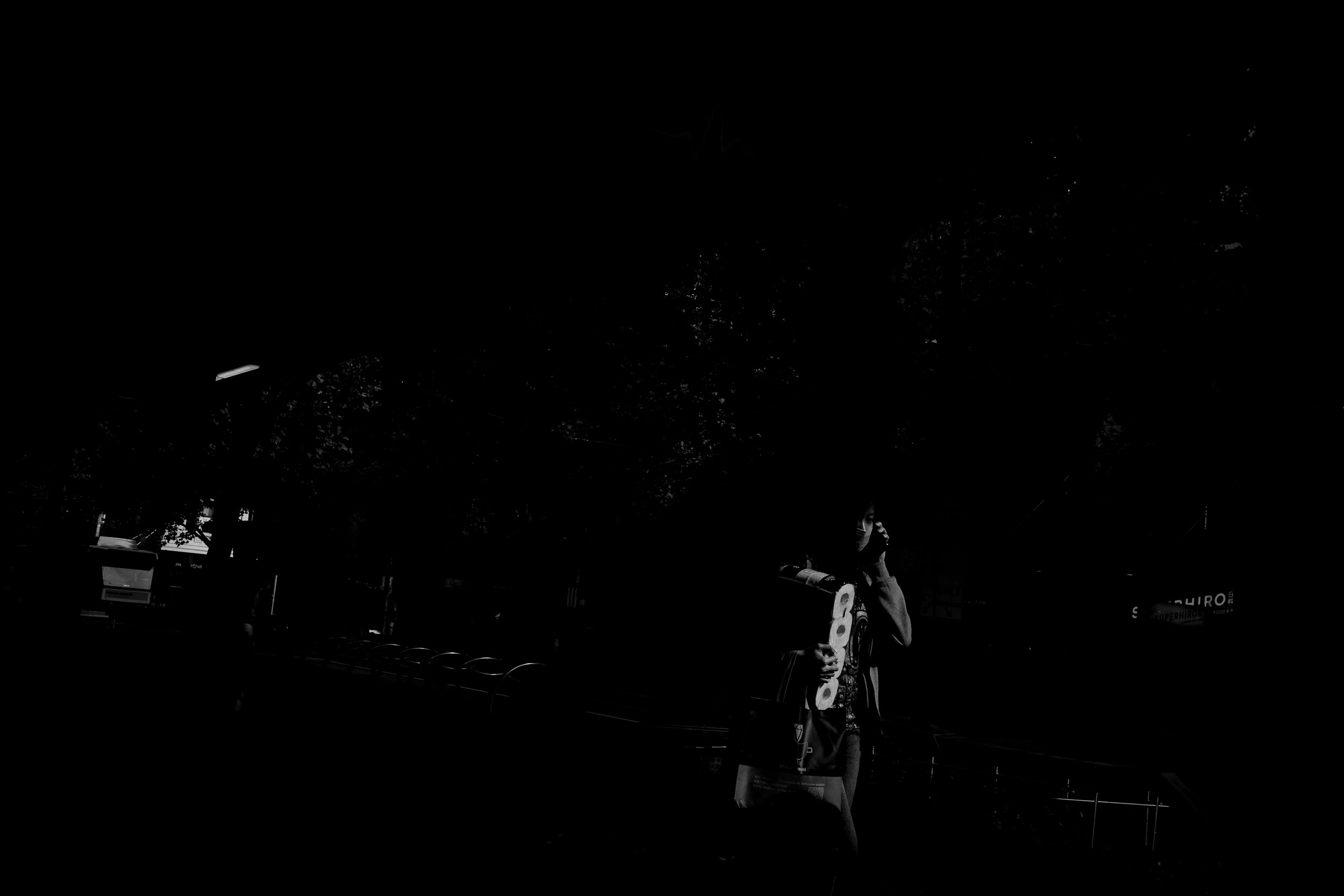  21/03/20 15:04 pm, Swanston Street, Melbourne. A solitary figure carries a roll of toilet paper through the CBD. Supermarkets battled to stock the oddly precious commodity through the early weeks of the outbreak and it lead to stores limiting the vo