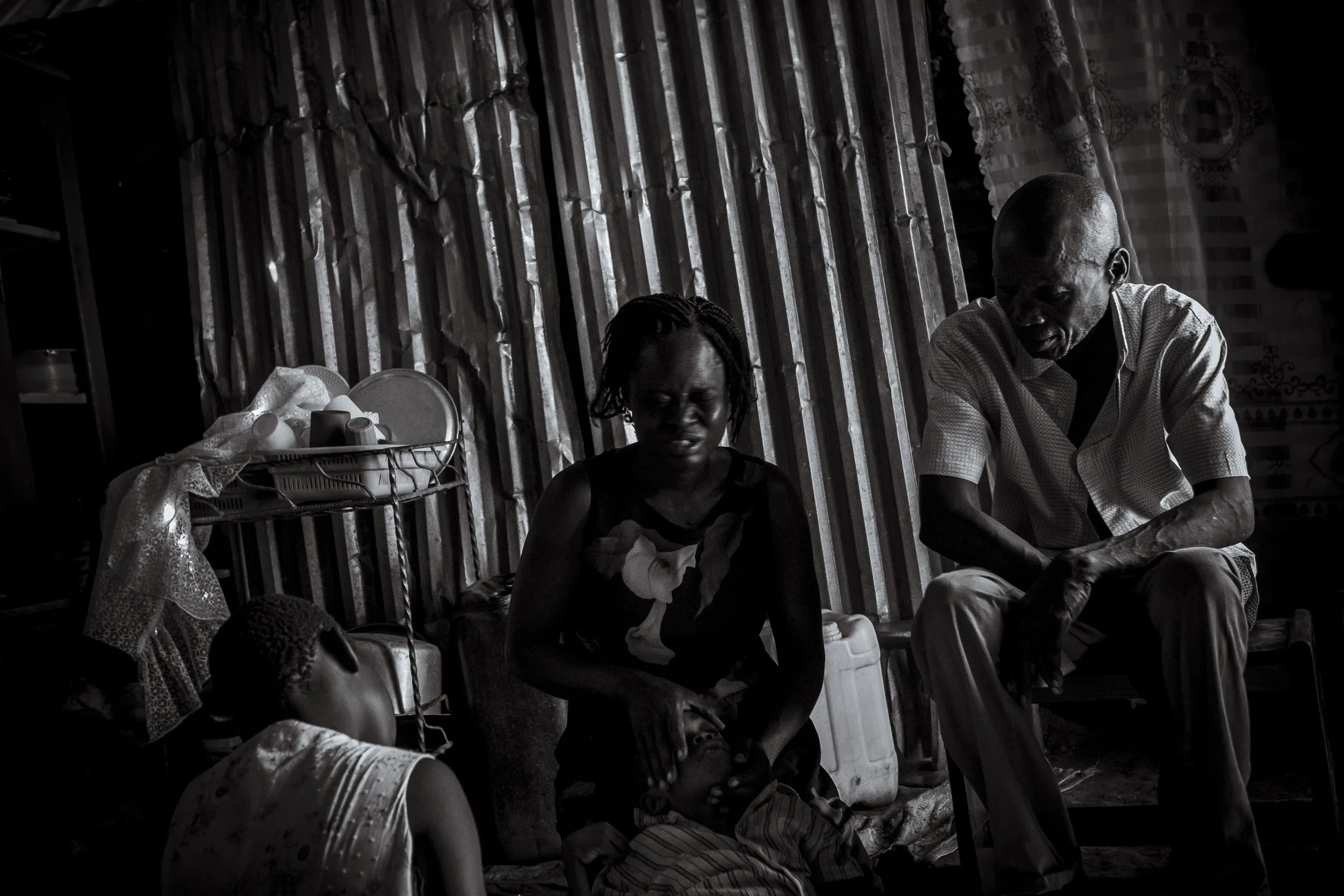  29 February 2020. Ojwina, Lira District, Uganda. The mother of seven-year-old Ezra Moro, Ages Nangobi breaks down whilst explaining her families recent experiences raising a child with a disability.   Ezra was born healthy. At age four he began to s