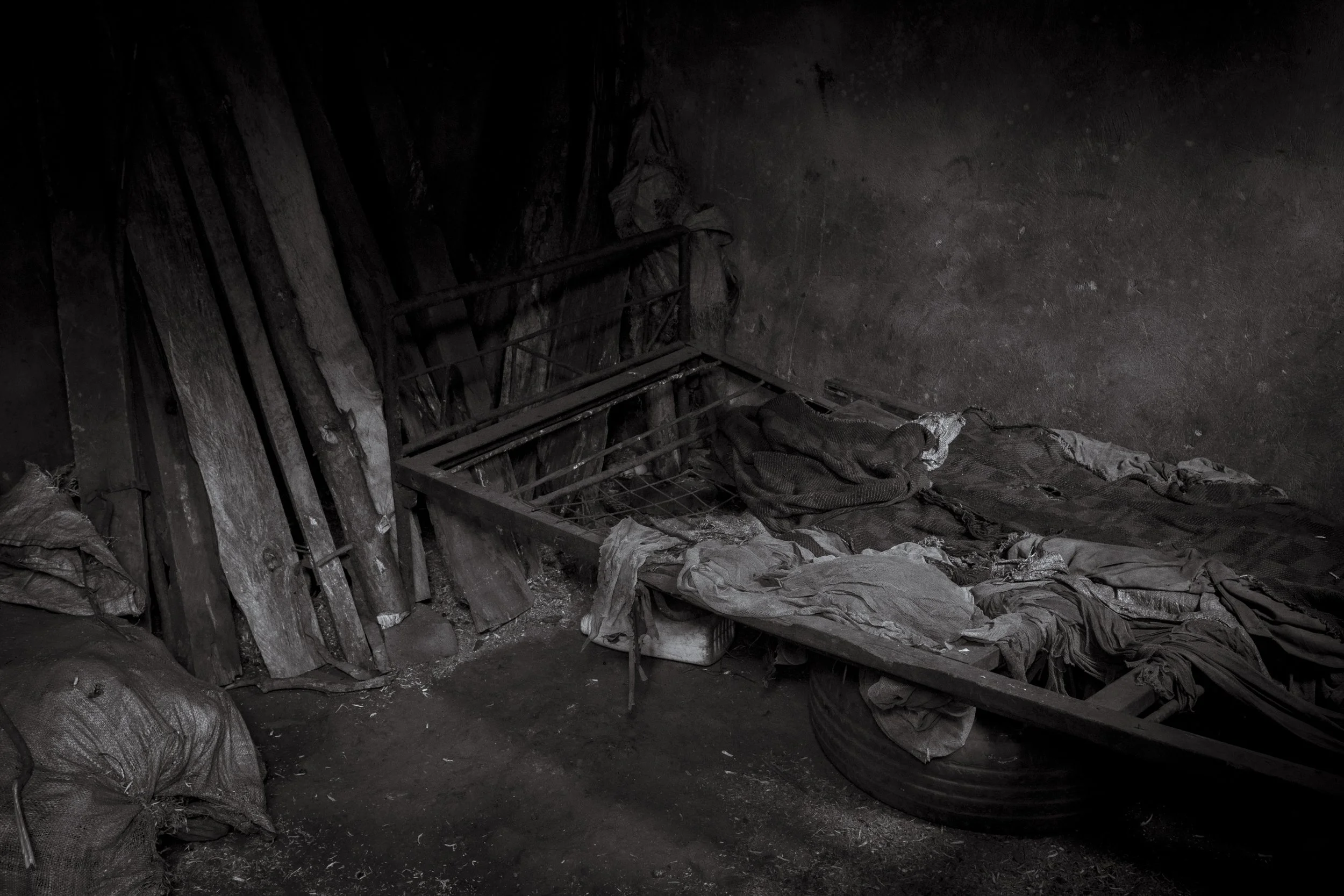  25 July 2023. Namazala, Jinja District, Uganda. The sleeping quarters of the victim of multiple rape, 20-year-old Katherine Muwunguzi.   'Kat' was raped constantly by a neighbour at a young age resulting in the pregnancy and birth of a son Edwin fou