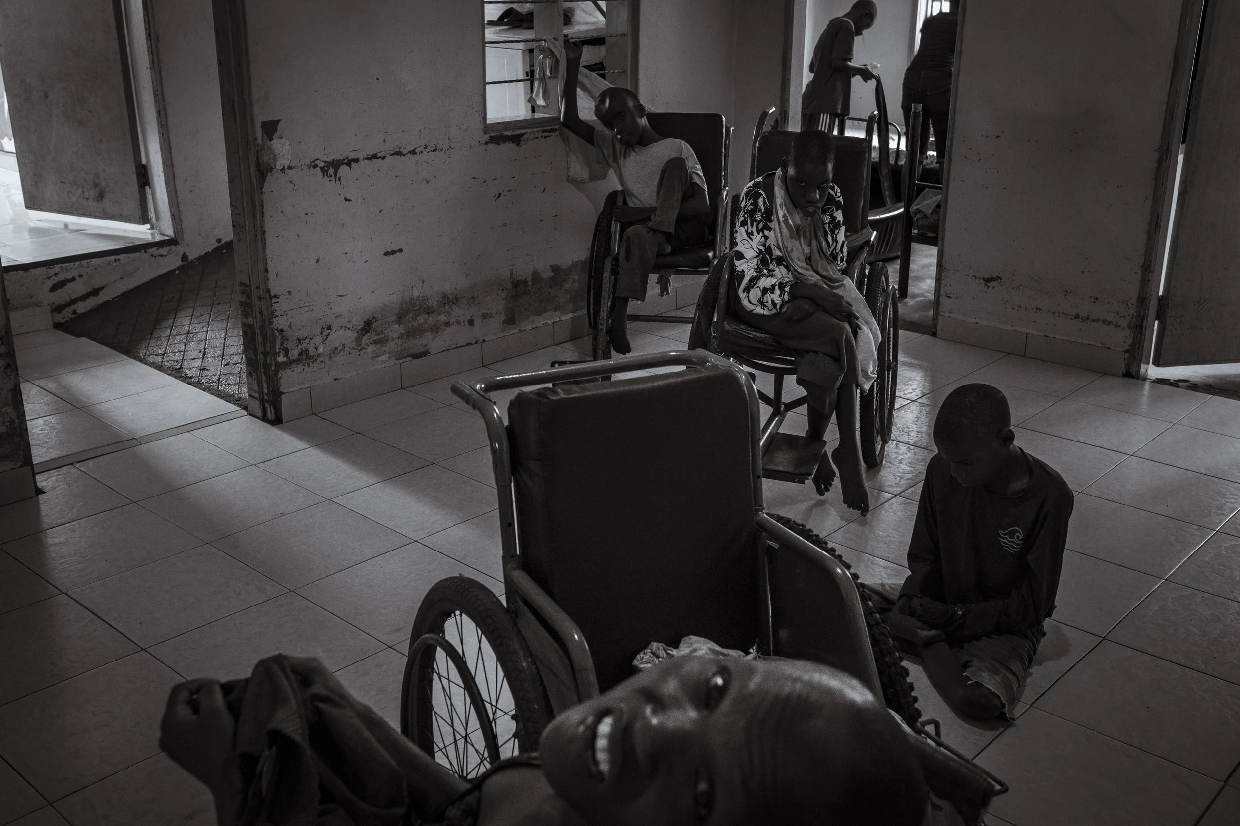  25 July 2023. Bugembe, Jinja District, Uganda. Teenagers living with conditions including Cerebral Palsy and Hydrocephalus await rehabilitation treatment in the therapy room at Home of Hope, a home, rehabilitation centre and hospital for abandoned c