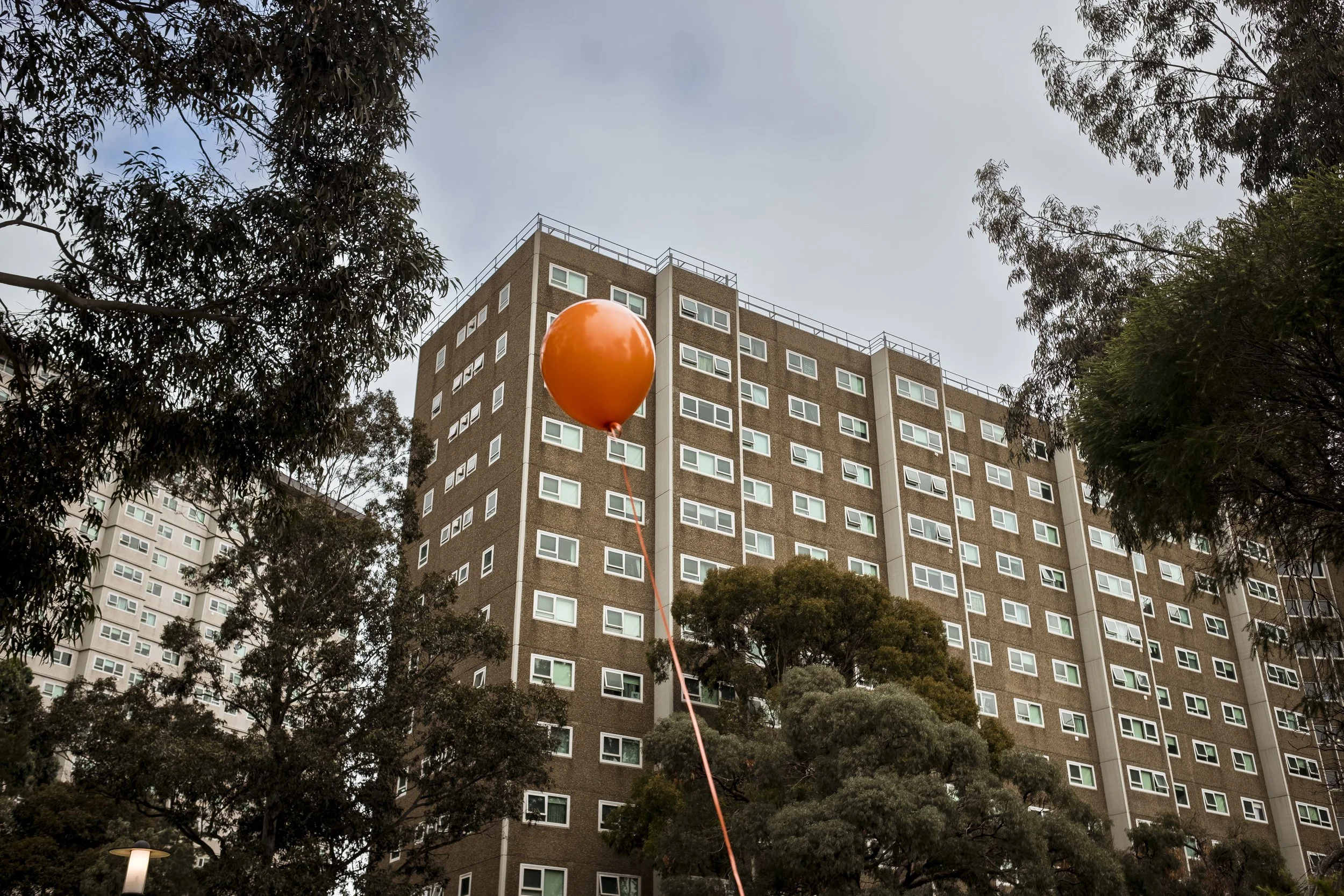 7 July 2020. Flemington, Australia. A balloon floats past the Flemington Housing towers as the residents of the towers are subjected to an enforced hard lockdown during the Covid-19 pandemic.   On the 4th July 2020, nine public housing towers housin