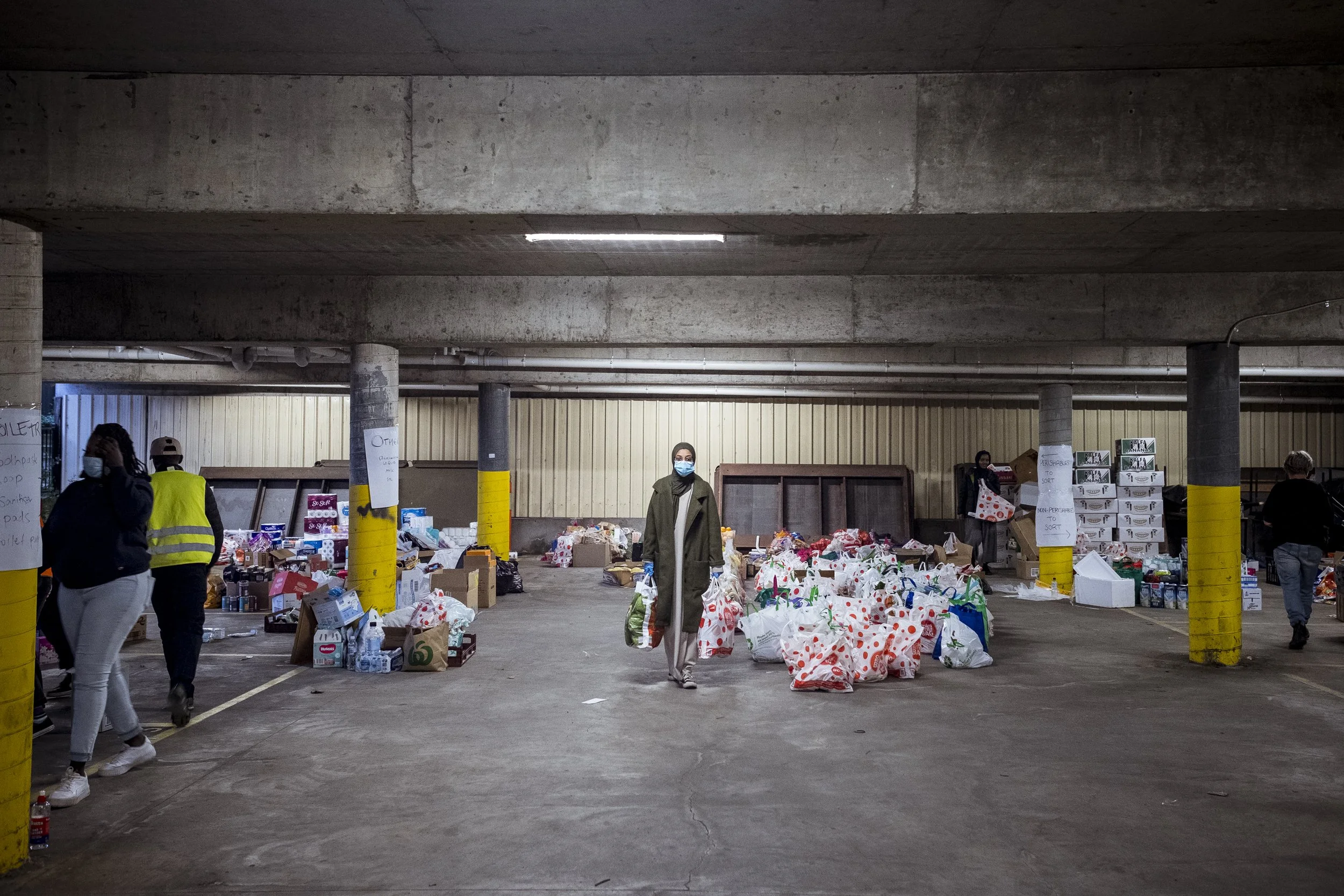  7 July 2020. North Melbourne, Australia. Hiba Shanino collects food and care items from the carpark of the Australian Muslim Social Services offices to take to those residents under enforced lockdown in the Alfred Street public housing towers. Hiba 