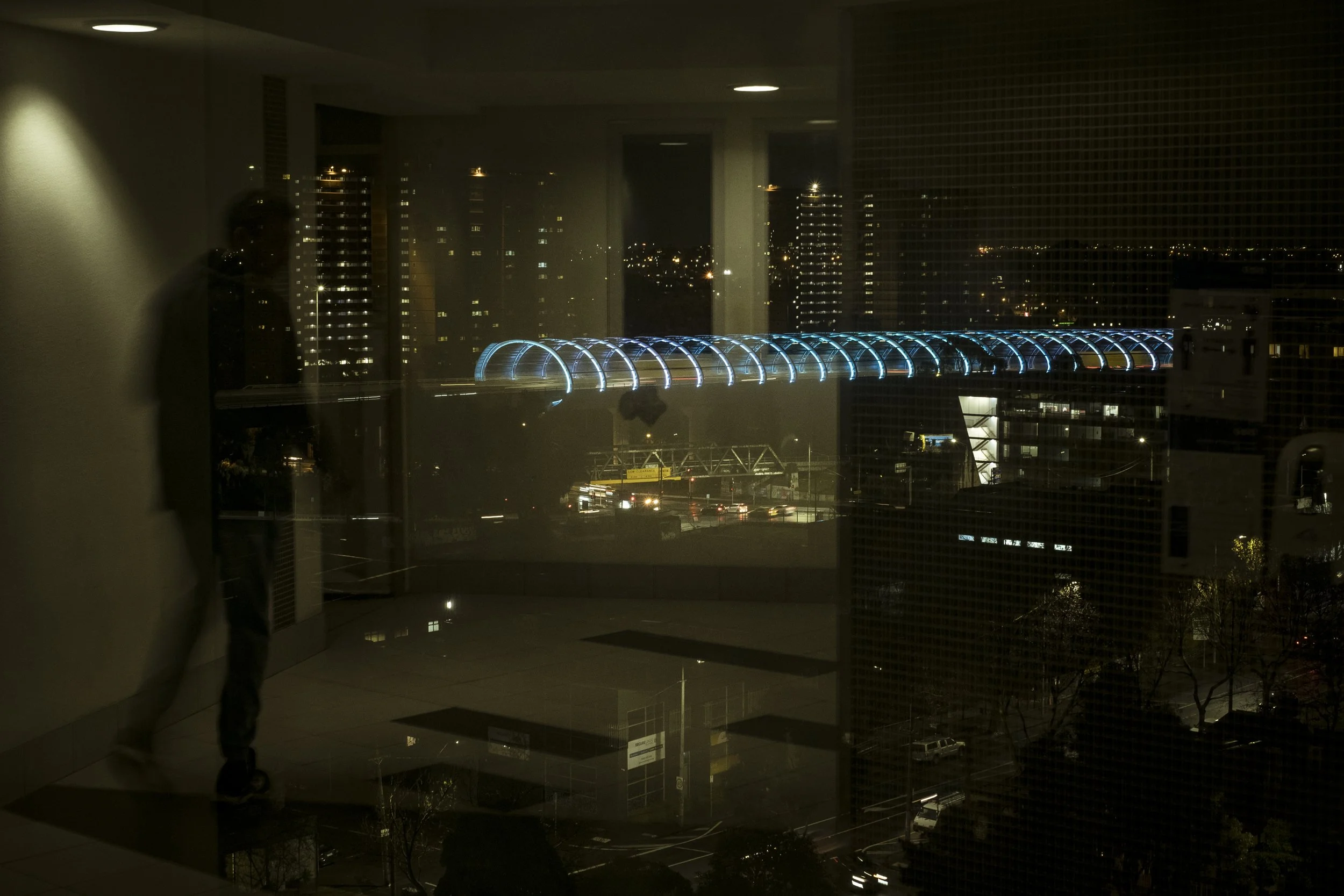  25 June 2021. 33 Alfred Street, North Melbourne, Australia. The Flemington housing community towers, which included four of the nine  towers within the 1.6km locked down radius -  are seen at night from Barry Berih's  floor of the Alfred Street towe