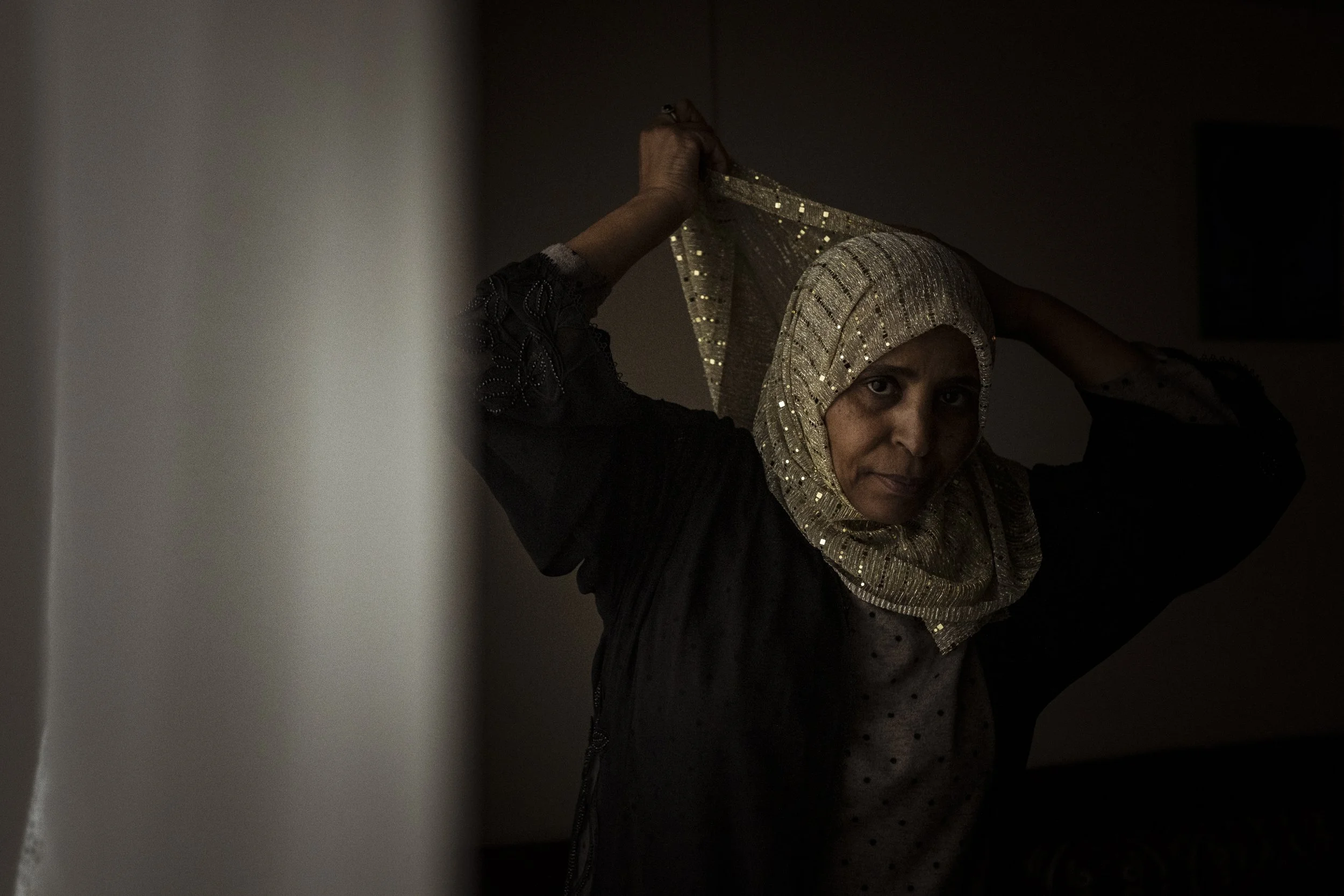  27 September 2023, 120 Racecourse Road, Flemington, Australia. Tehiya Umer adjusts her Hijab before cooking her families supper.   Tehiya, who is of Oromo descent, is a resident at 120 Racecourse Road, one of the public housing towers in Flemington.
