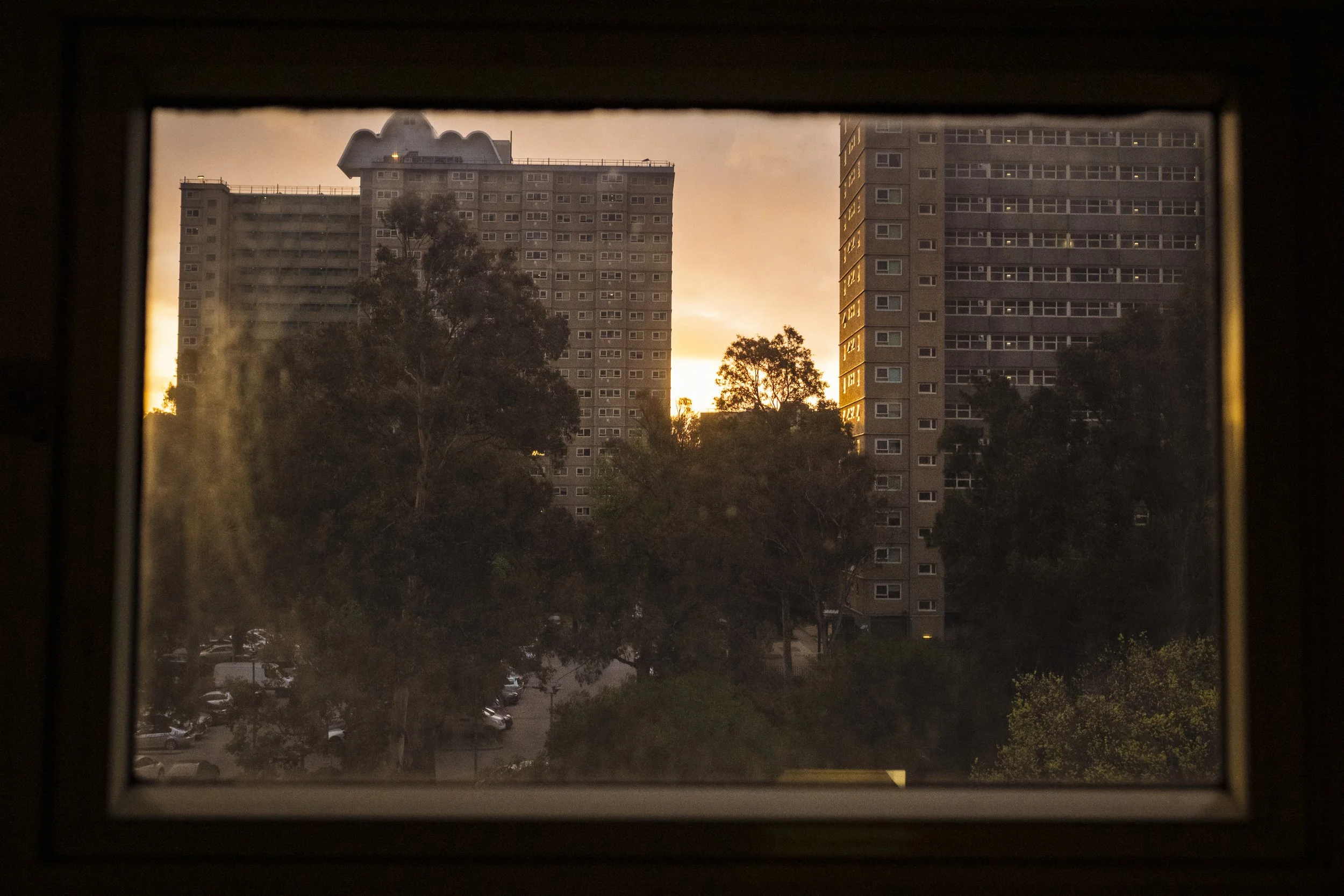  27 September 2023, 120 Racecourse Road, Flemington, Australia. The sun sets over the Flemington public housing towers.  There are currently about 10,000 people living in the 44 towers and once they have been redeveloped, the estates will house about