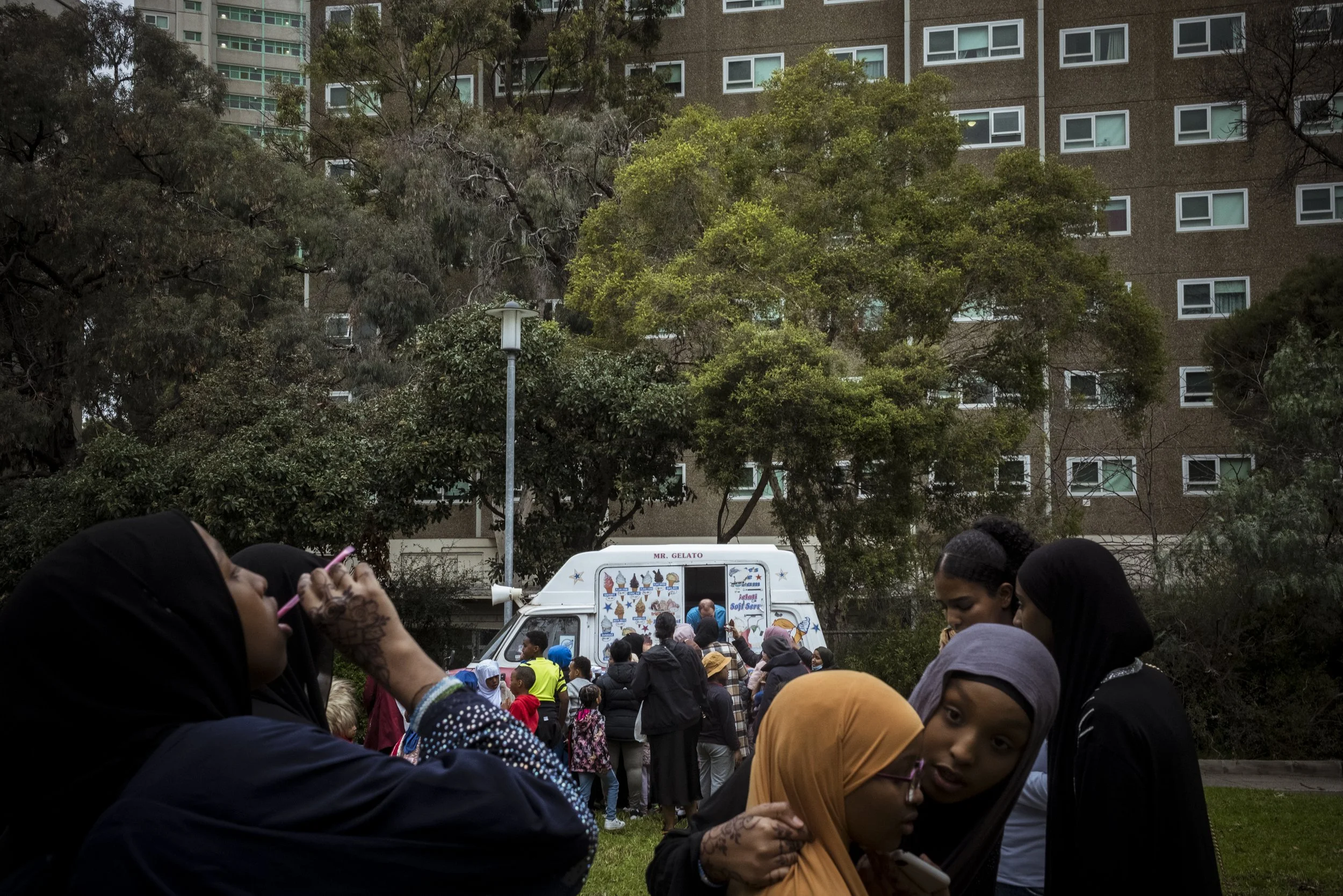  22 June 2024. 33 Alfred Street, North Melbourne, Australia. Young public housing residents line up for ice-cream and treats at a celebration for Eid organised by the local Melbourne Somali Community group. Tightly knit diaspora communities will be h