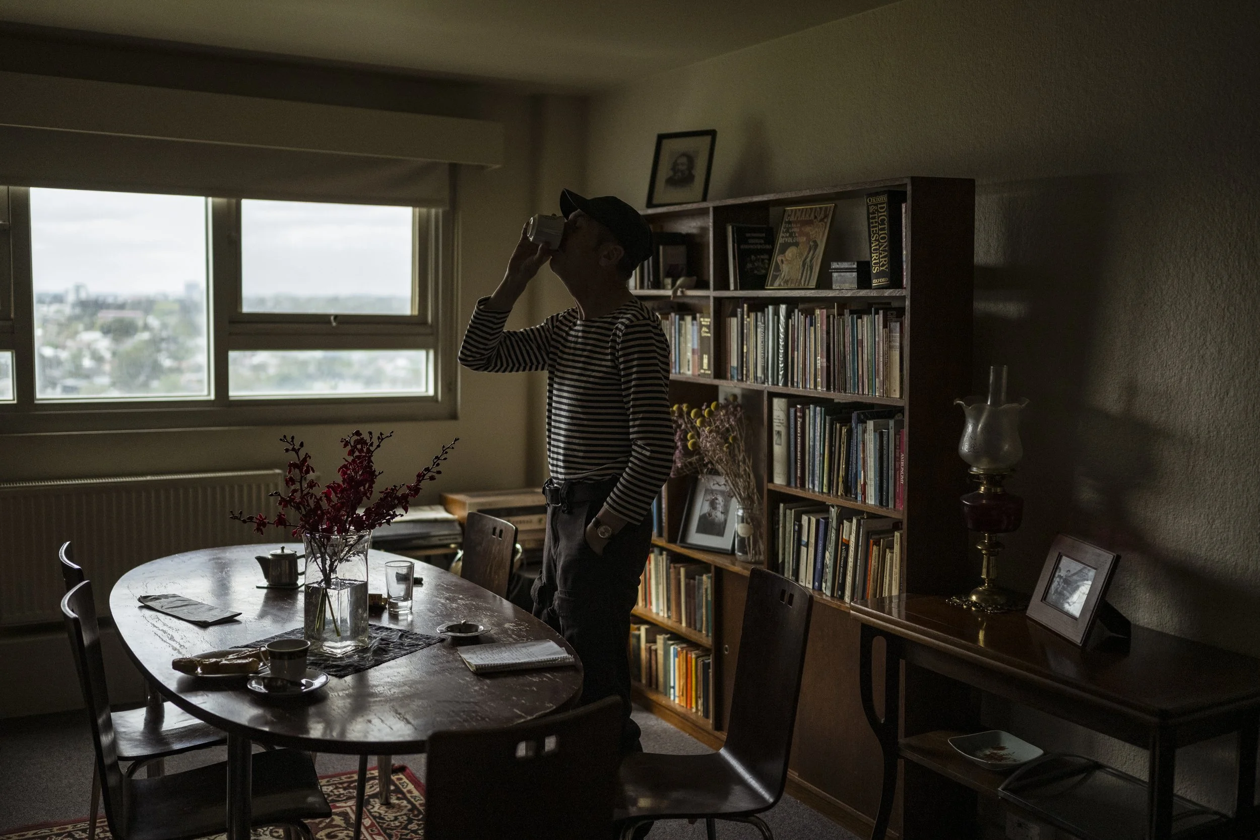  8 October 2025. 1 Holmes Street, Northcote, Australia. Ian 'Hank' Ferguson sips a coffee in his apartment. Hank is eternally grateful for his apartment and upon receiving his offer of a permanent home he rejoiced over the thought that he may never h