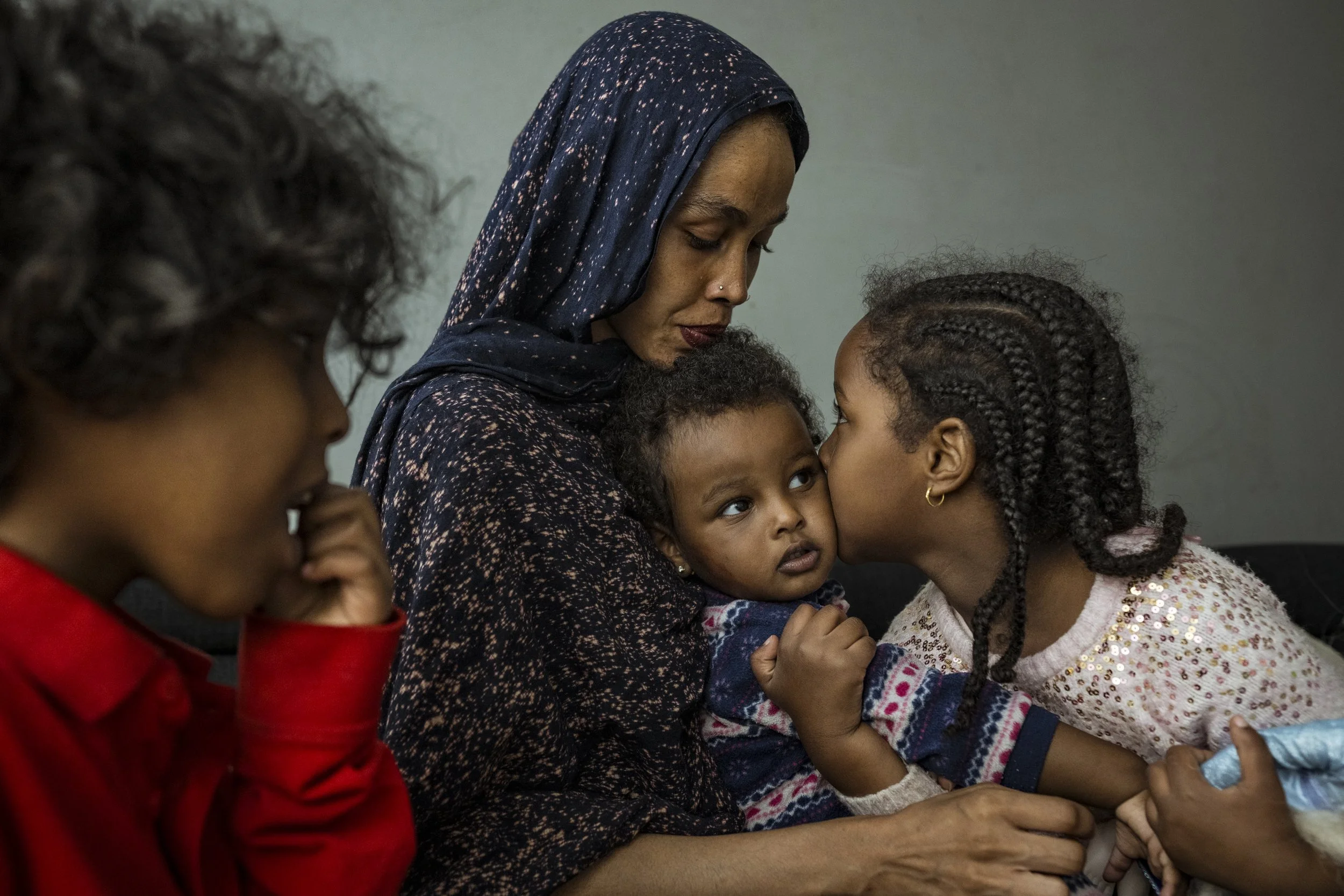  29 January 2025. 95 Napier Street, Fitzroy, Australia. Atherton Gardens public housing resident, Ragto Muse with her children Amara, 1, Ayah, 4, and Ali, 8, in their apartment,Fitzroy.   Ragto has lived most of her life in public housing, and she ta