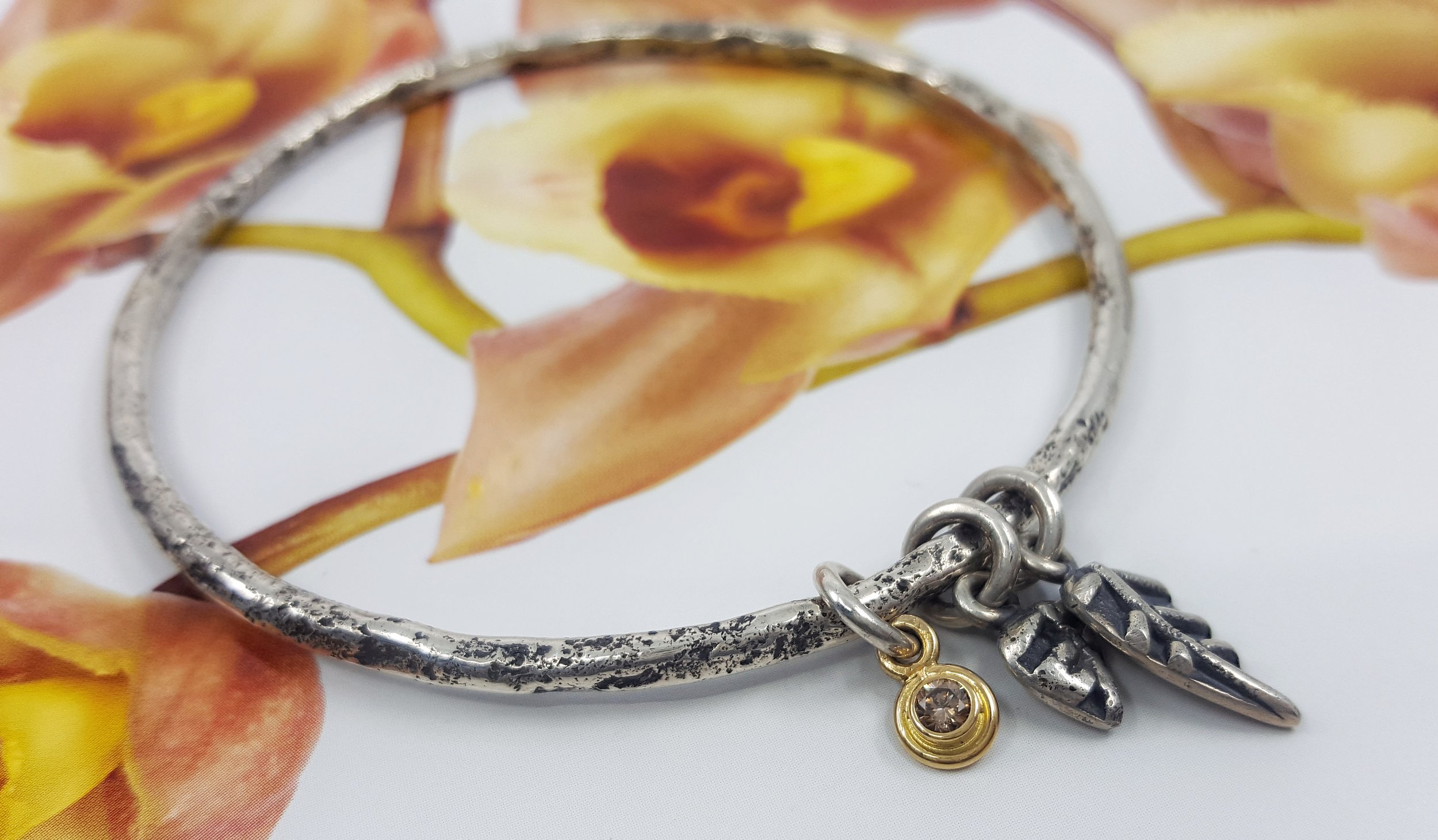 Sterling silver textured bangle with fused charms and 11pt cognac diamond set in 18ct yellow gold - $979