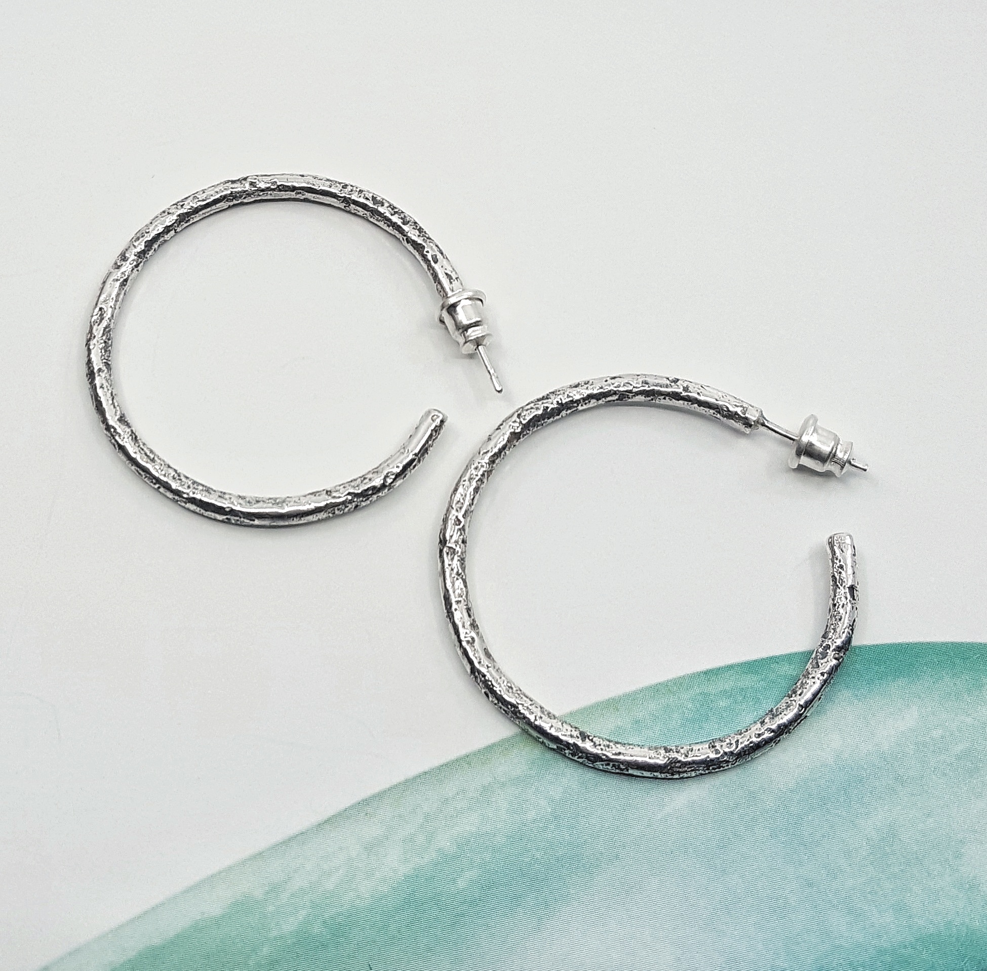 sterling silver textured hoops - $199