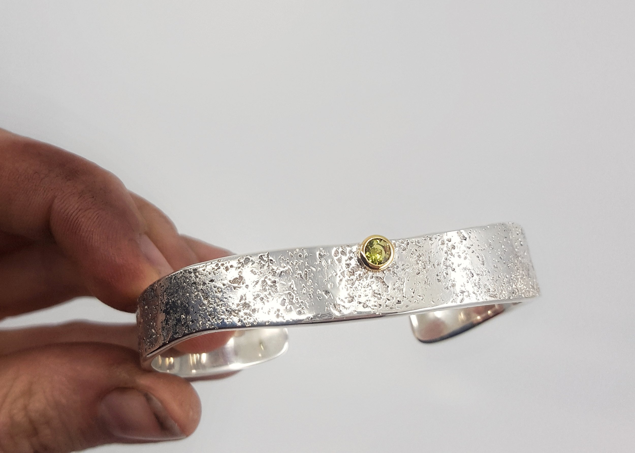 'Coastline', sterling silver and 18ct yellow gold, 0.30ct Australian green sapphire