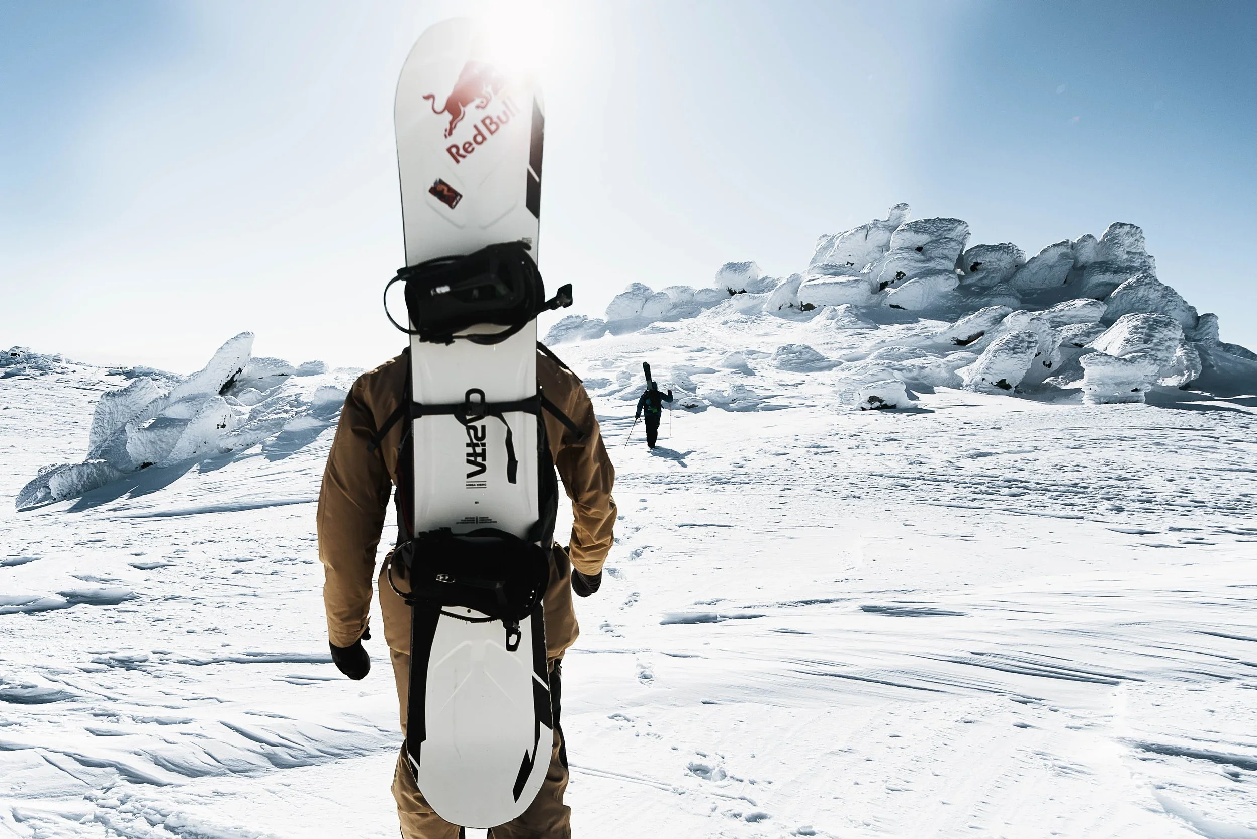 Extreme winter expedition photography - snowboard athlete in arctic landscape.
