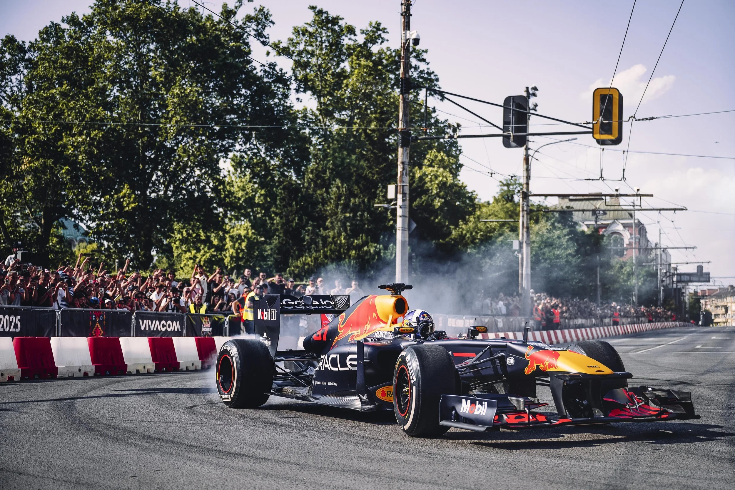 Formula 1 burnout demonstration - live city motorsport event photography.