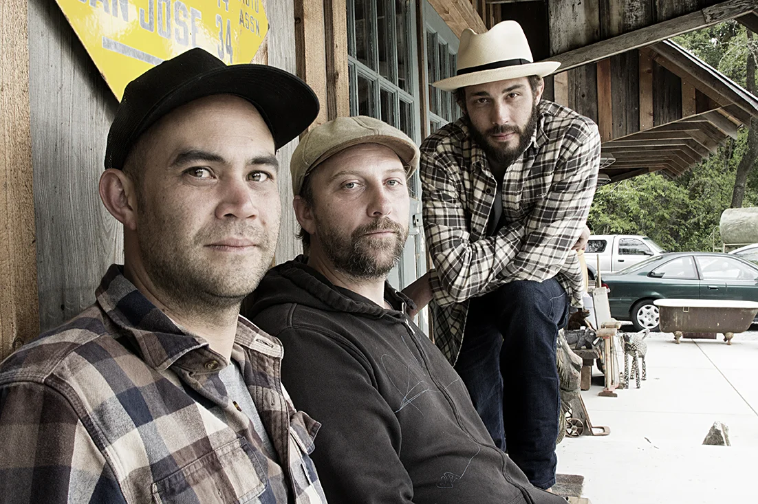 (L to R) Andrew Gibson (upright & electric bass|vocals) • John Howland (electric & acoustic guitars|vocals) • Lucas Ohio Pattie (vocals|guitar, harmonica)