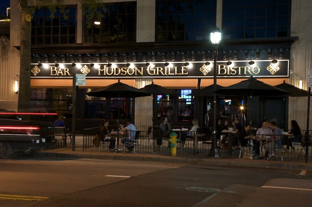 Hudson Grille storefront on Mamaroneck Avenue at night