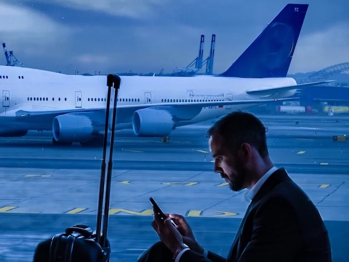 SeatedmanPlaneinbackgroundCorporateTravel.jpg