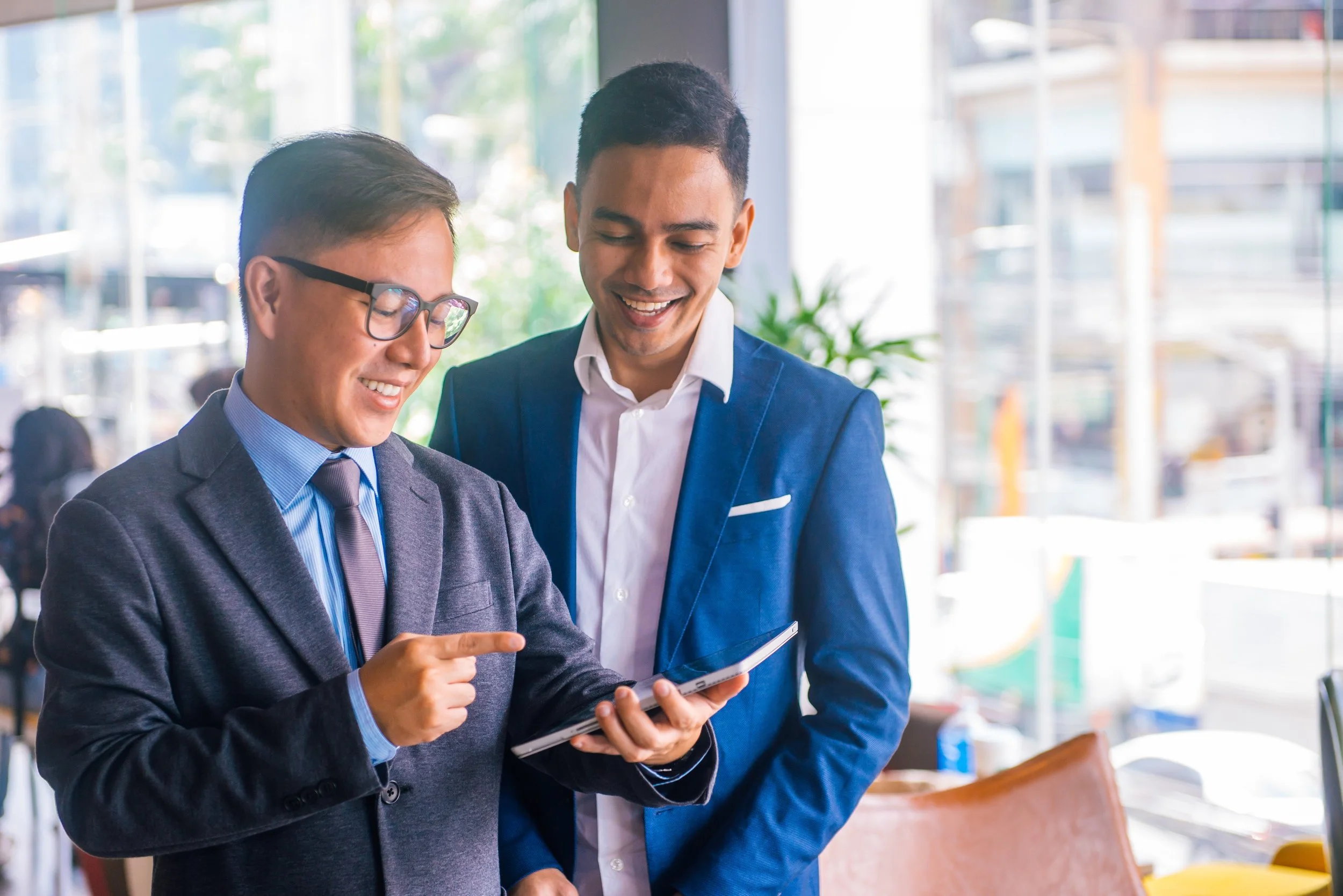 men-meeting-to-discuss-on-tablet.jpg