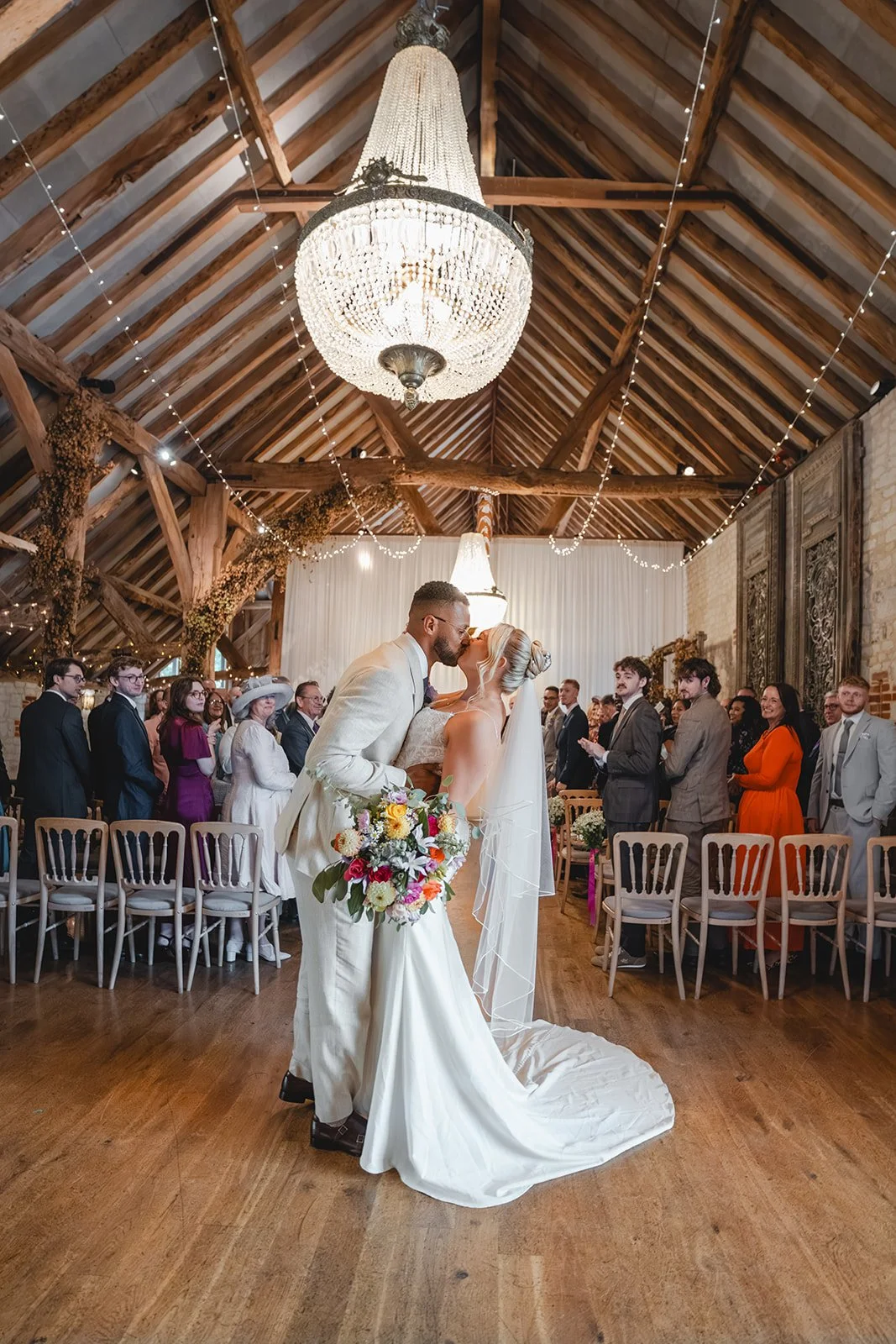 Kirsten and Josh kissing after the wedding ceremony