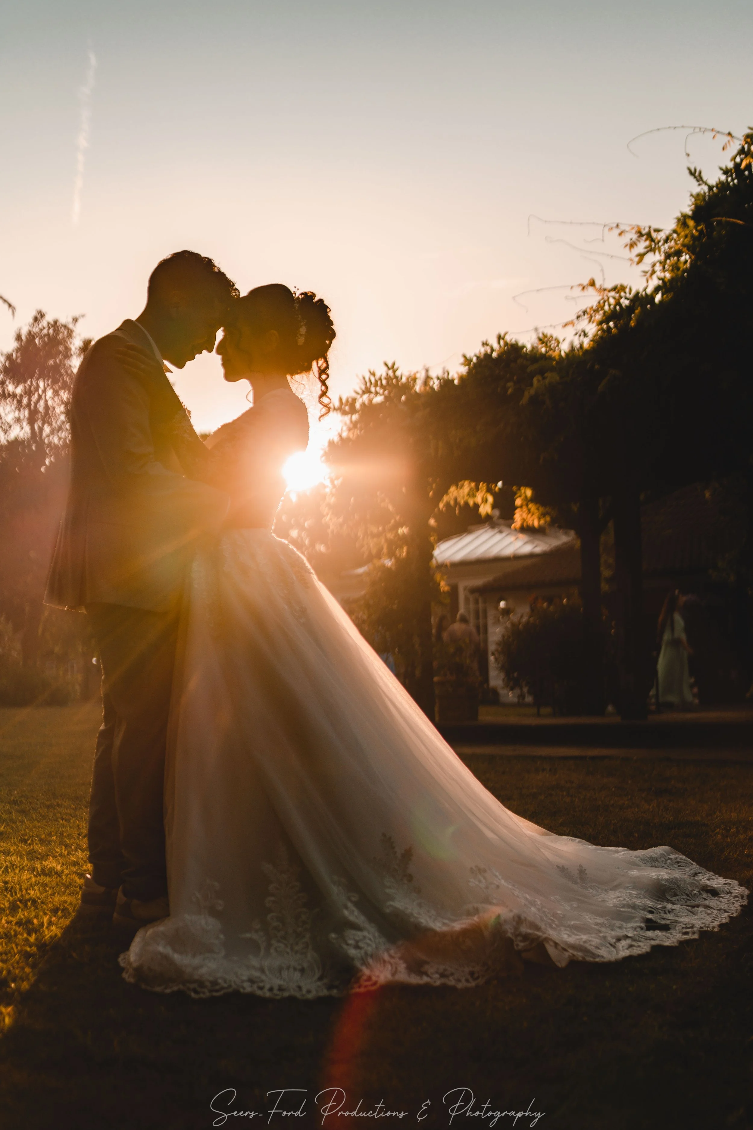 Jennifer and Gabriel sunset silhouette wedding portrait