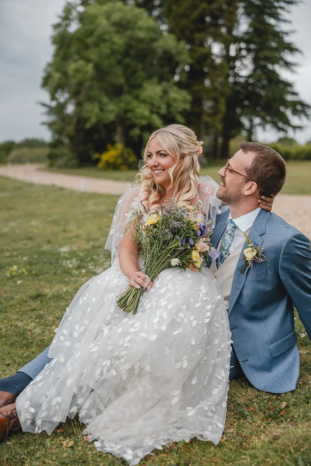 Jonny and Abi relaxed couple portrait on the grass