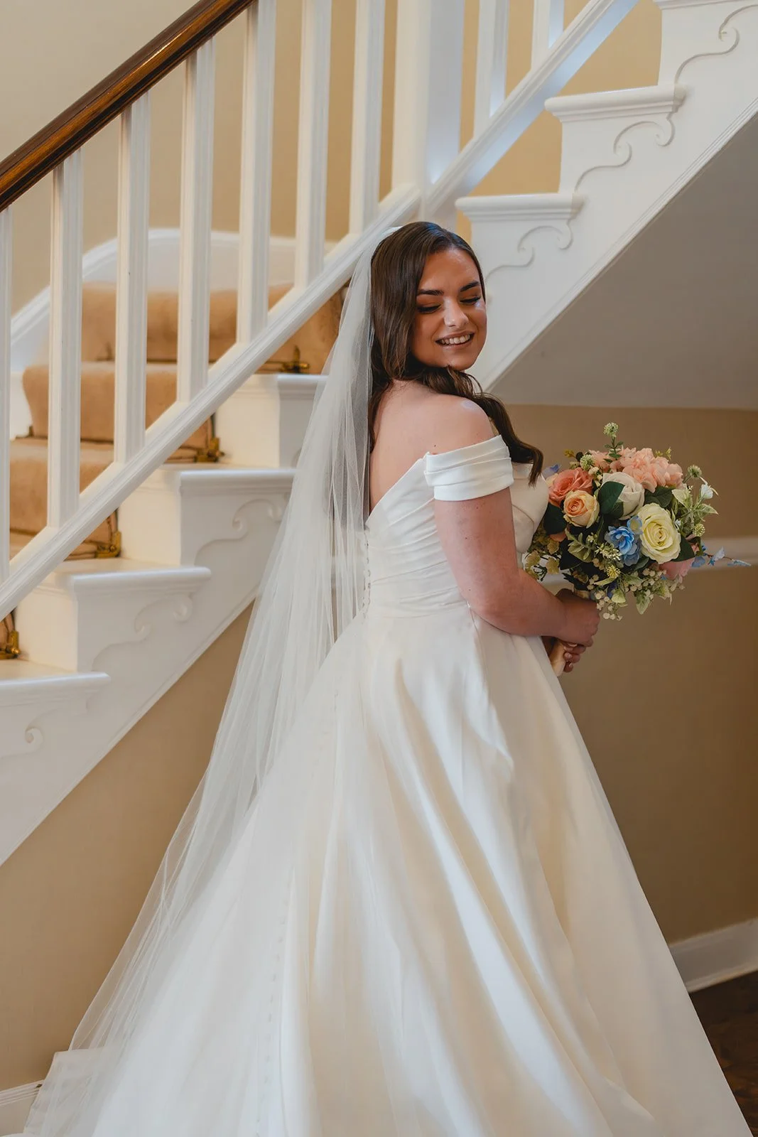 Shannon smiling with bouquet before her wedding ceremony