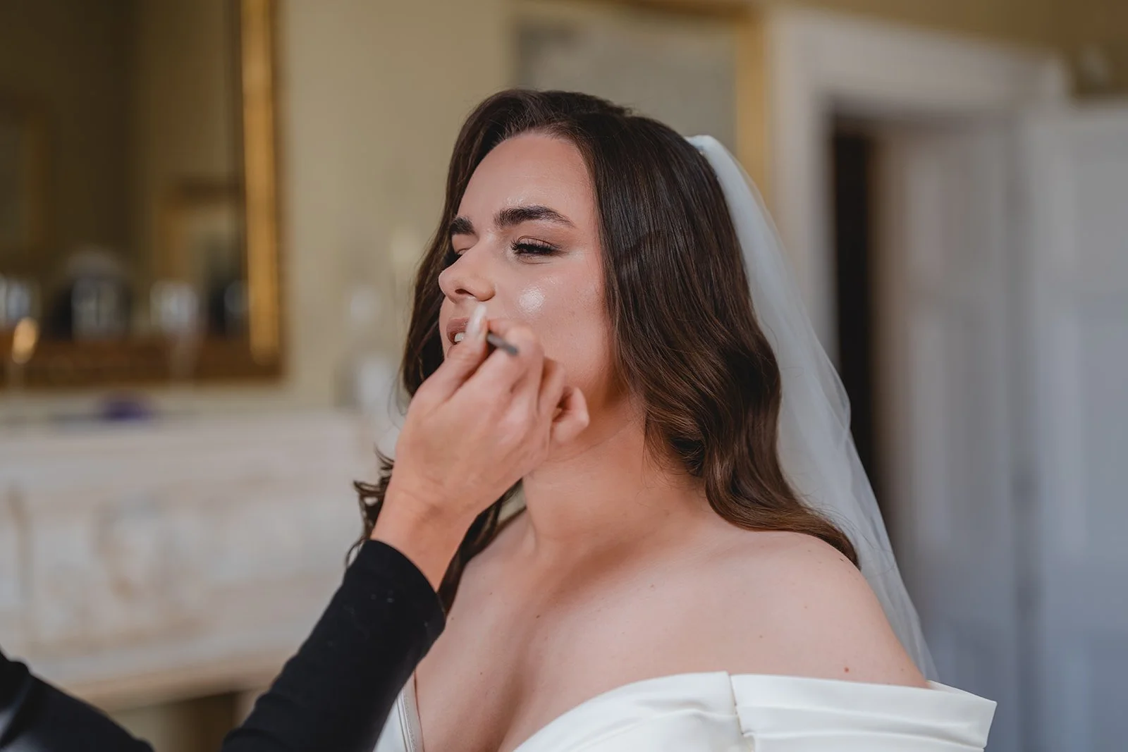 Shannon having bridal makeup applied