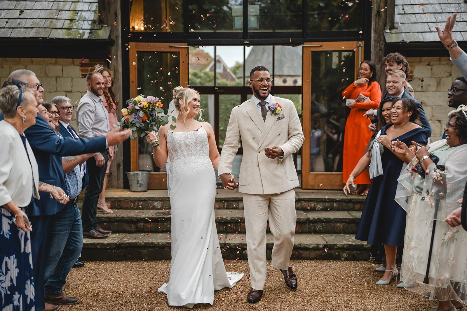 Kirsten and Josh walking through confetti after ceremony