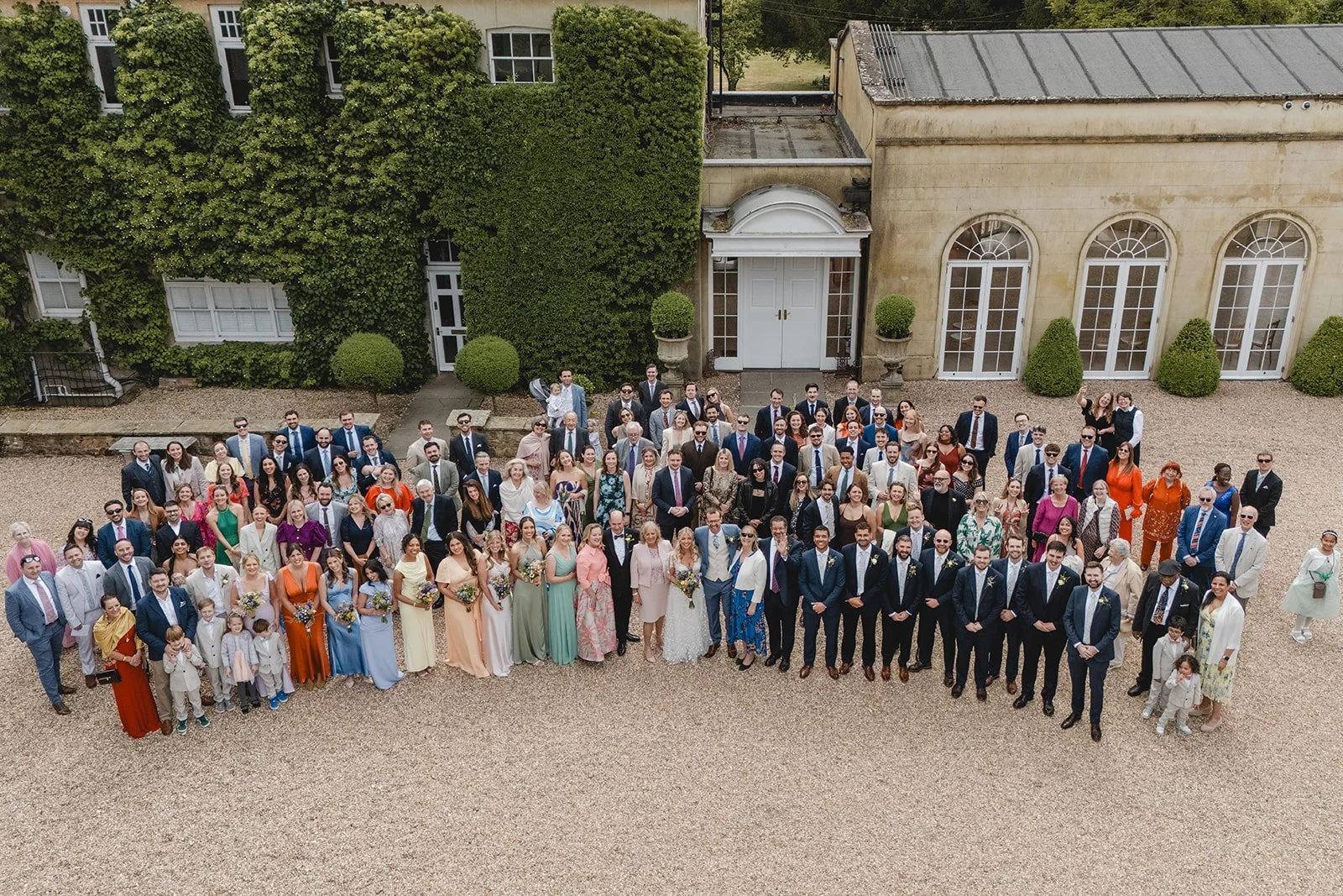 Large group photograph of Jonny and Abi with all their wedding guests