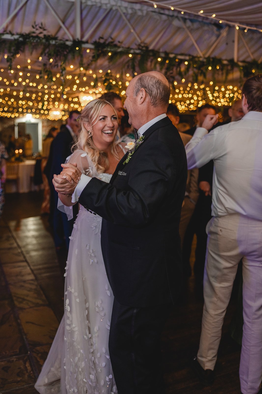 Abi dancing with a family member during the evening reception