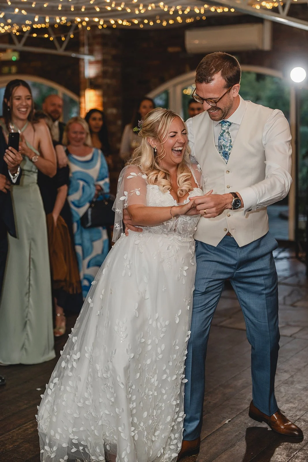 Jonny and Abi laughing during their evening reception