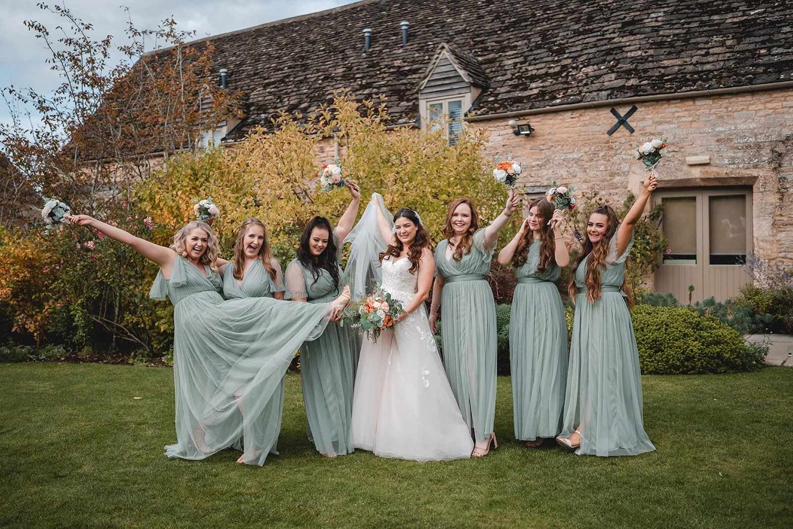 Bride with bridesmaids outside wedding venue