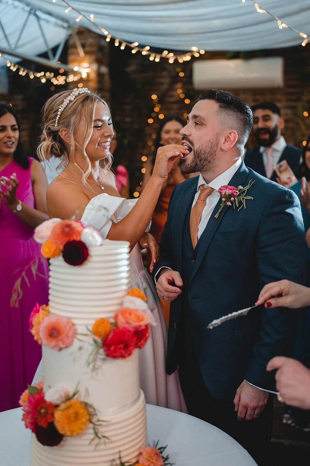 Wedding cake cut moment