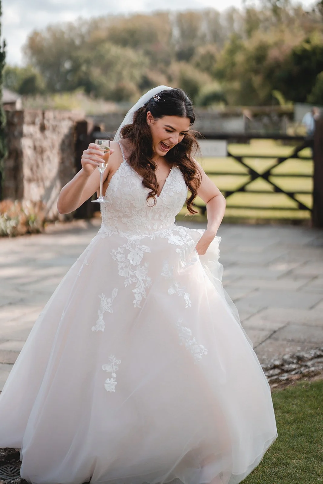Sartis celebrating in her wedding dress