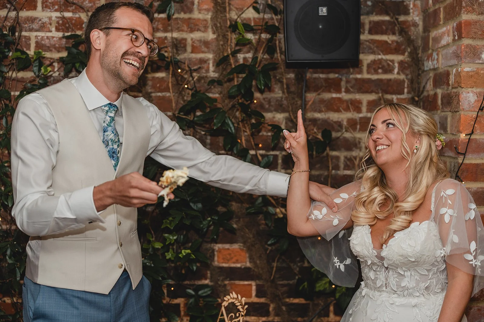 Jonny and Abi cutting their wedding cake