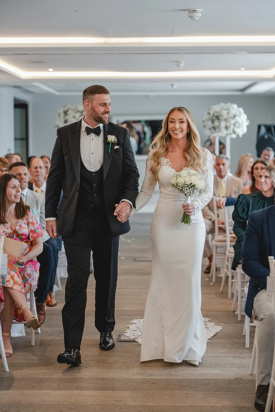 Mike and Lacey walking down the aisle