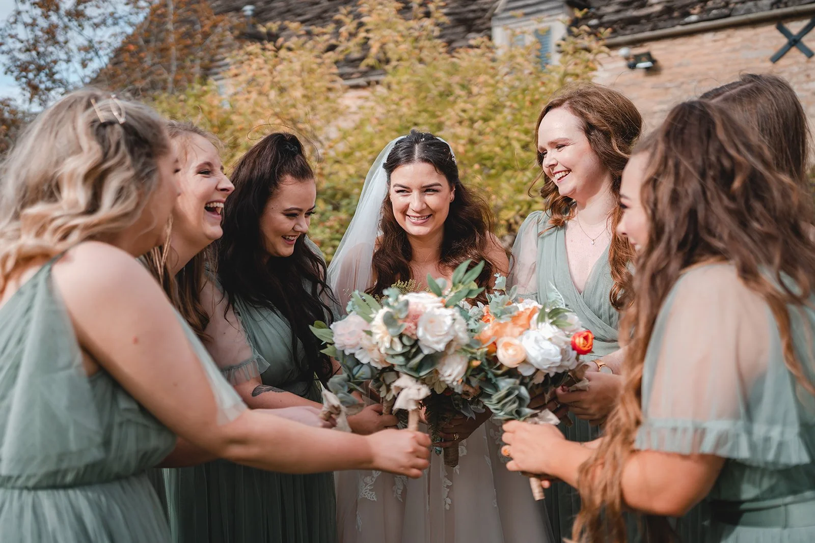 Sartis laughing with bridesmaids
