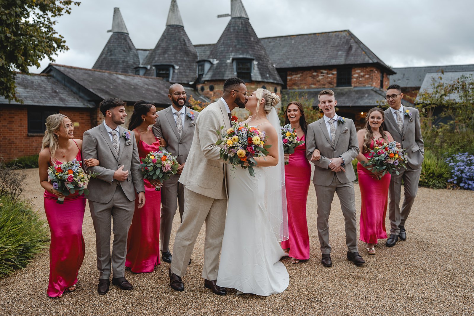 Kirsten and Josh with their wedding party outside the venue