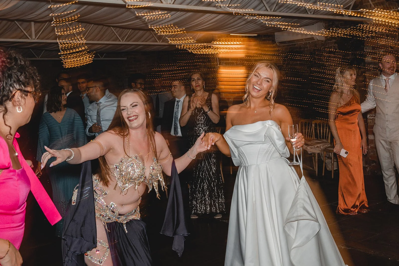 Bride dancing at evening wedding reception