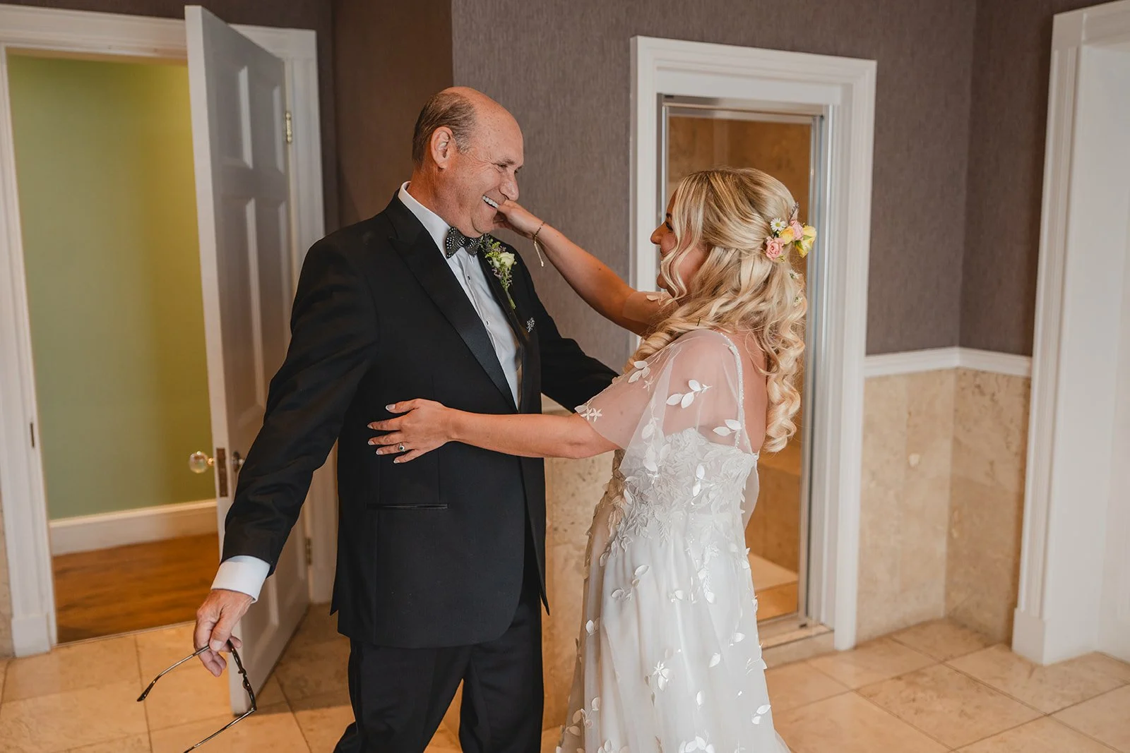 Abi sharing a first look moment before the ceremony