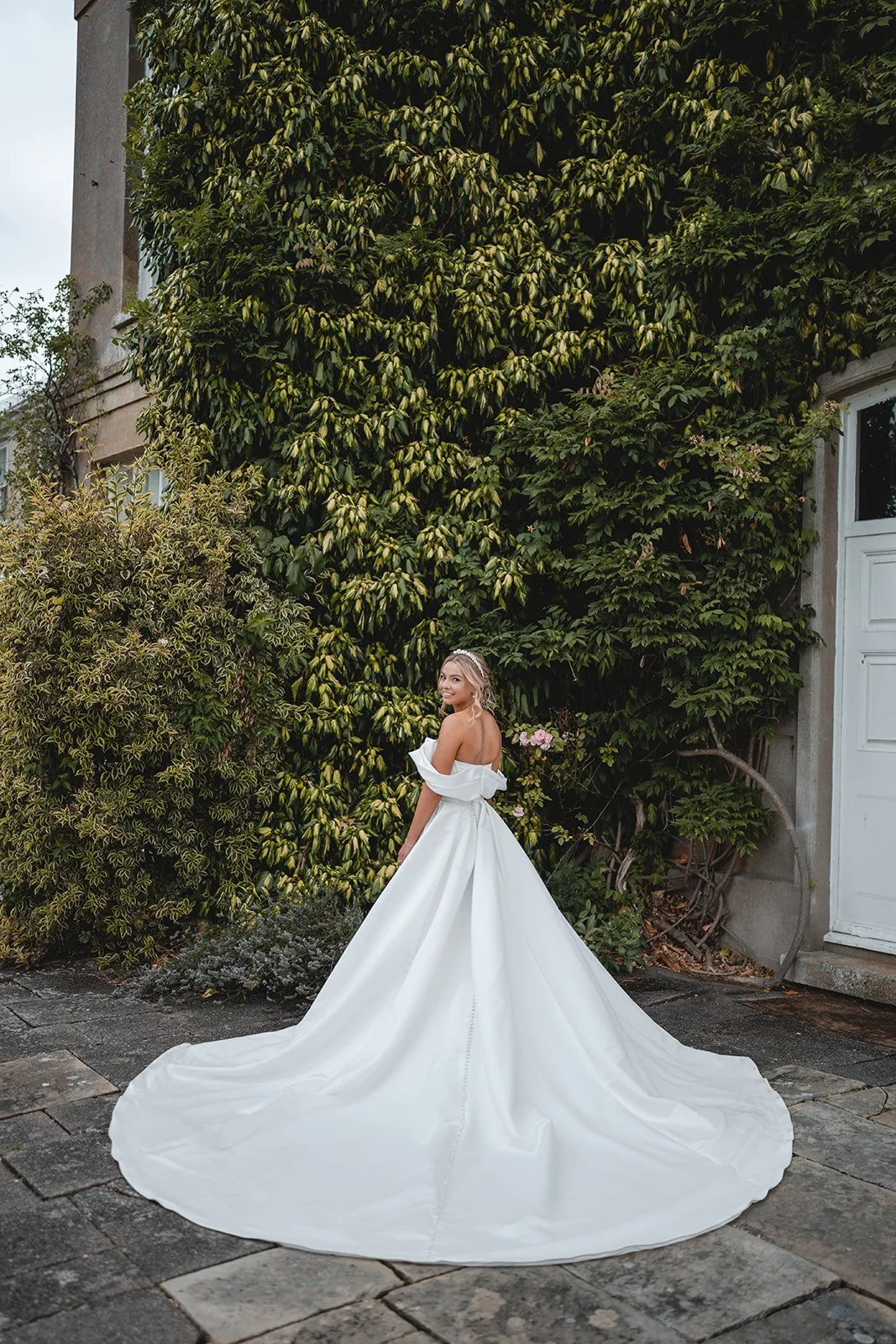 Bride portrait showing wedding dress train