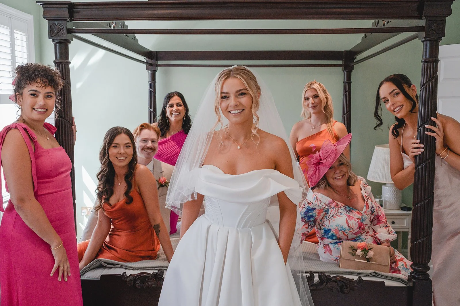 Bride with bridesmaids and family before ceremony