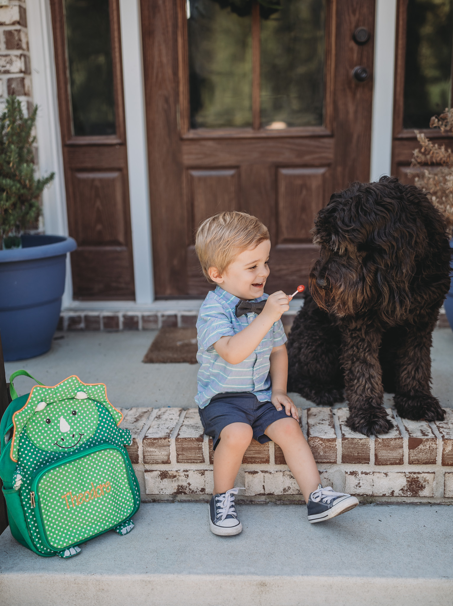 child and goldendoodle starting school