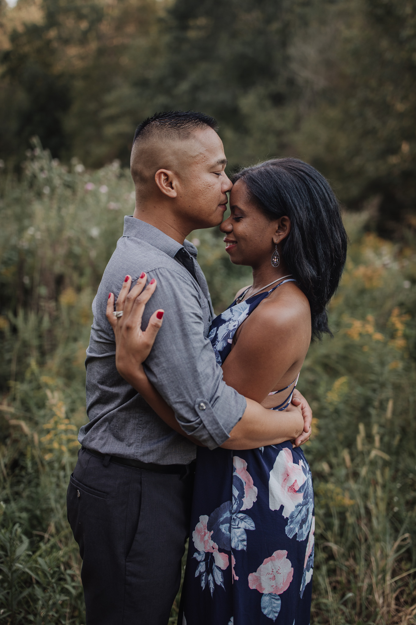 engaged couple kissing