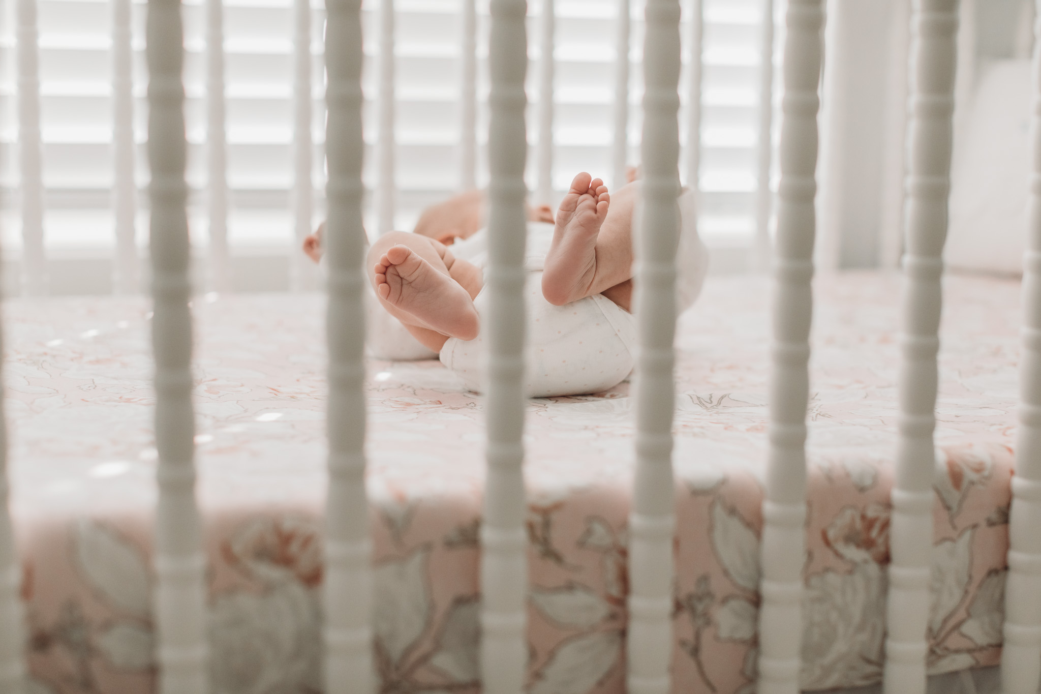 Baby Feet through Crib