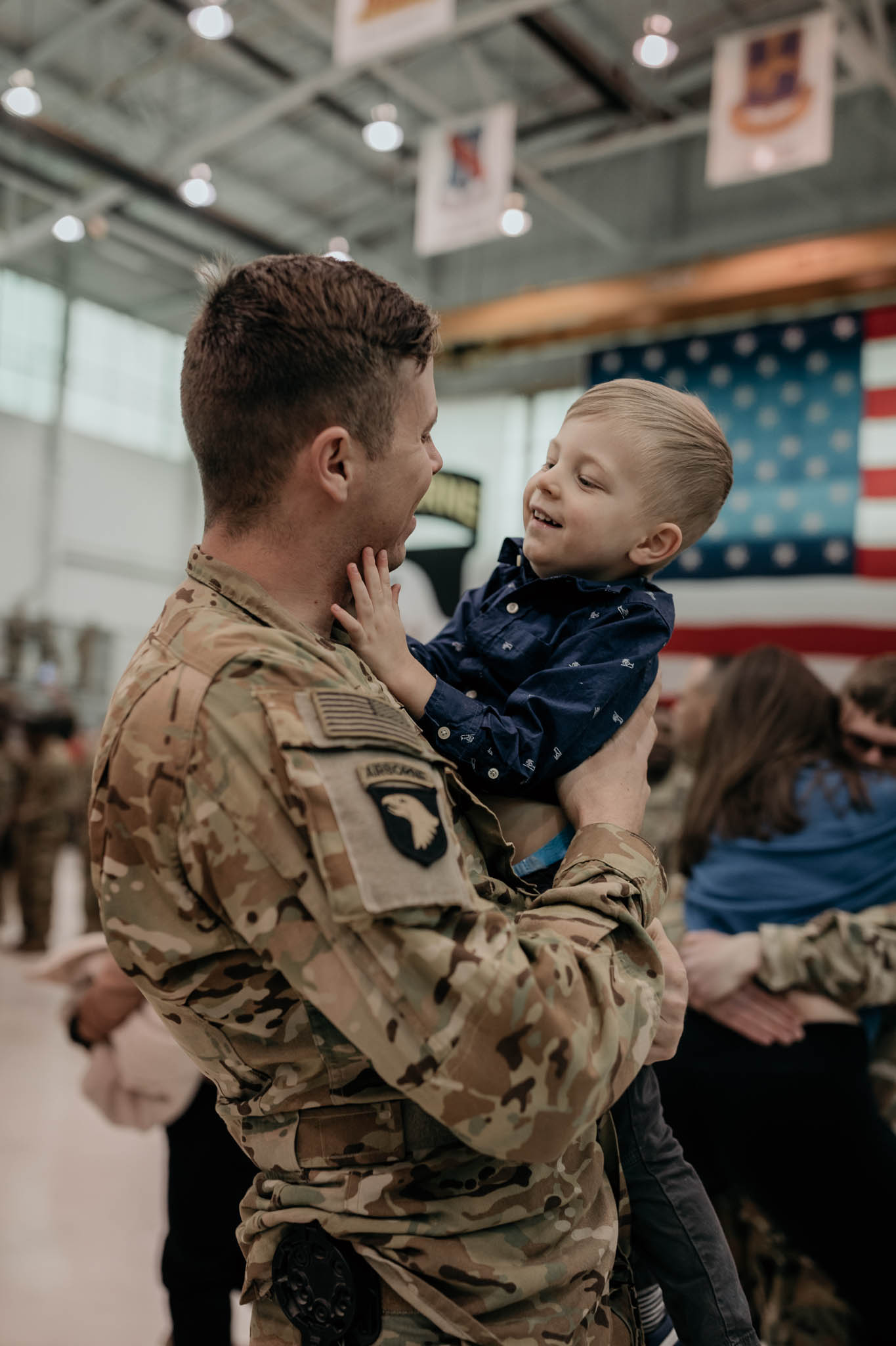 Soldier Holding Son