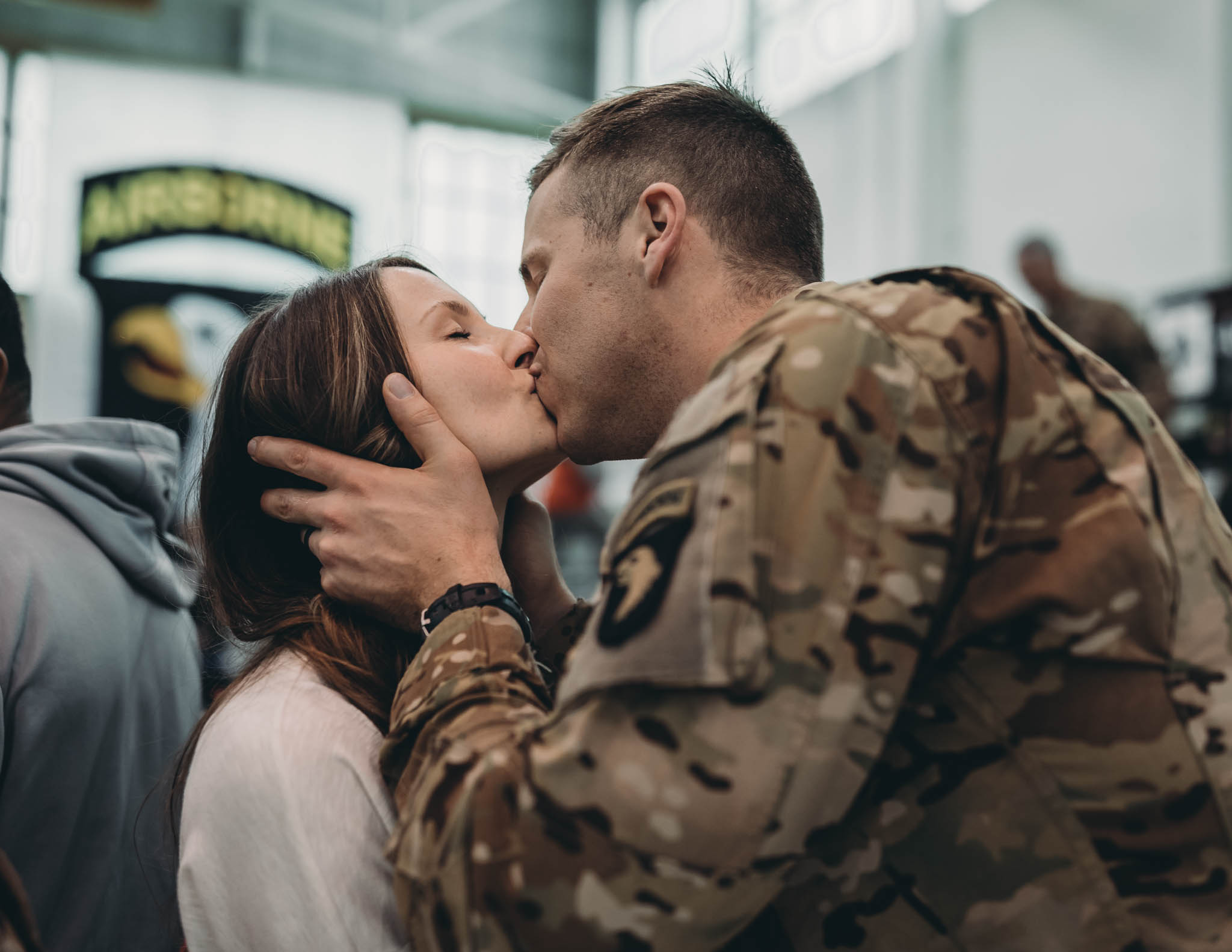 Soldier and Wife Kissing