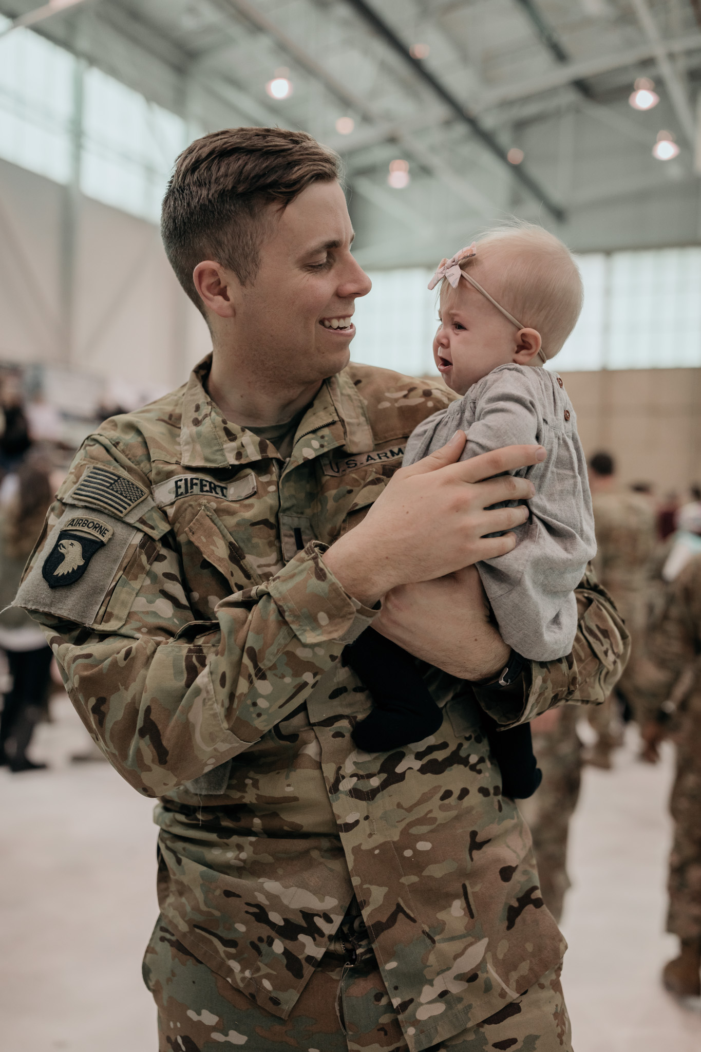 Soldier Holding Daughter