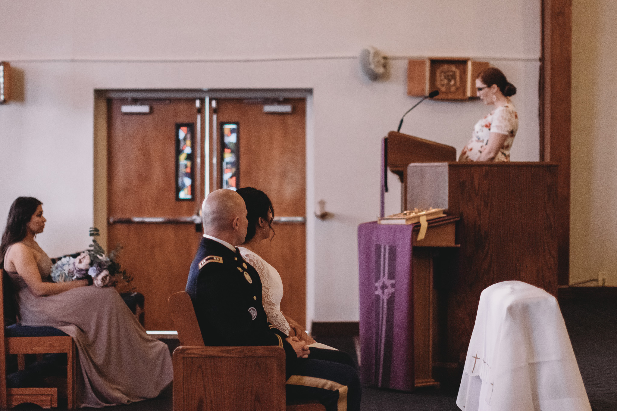 Bride and Grooming Sitting During Ceremony