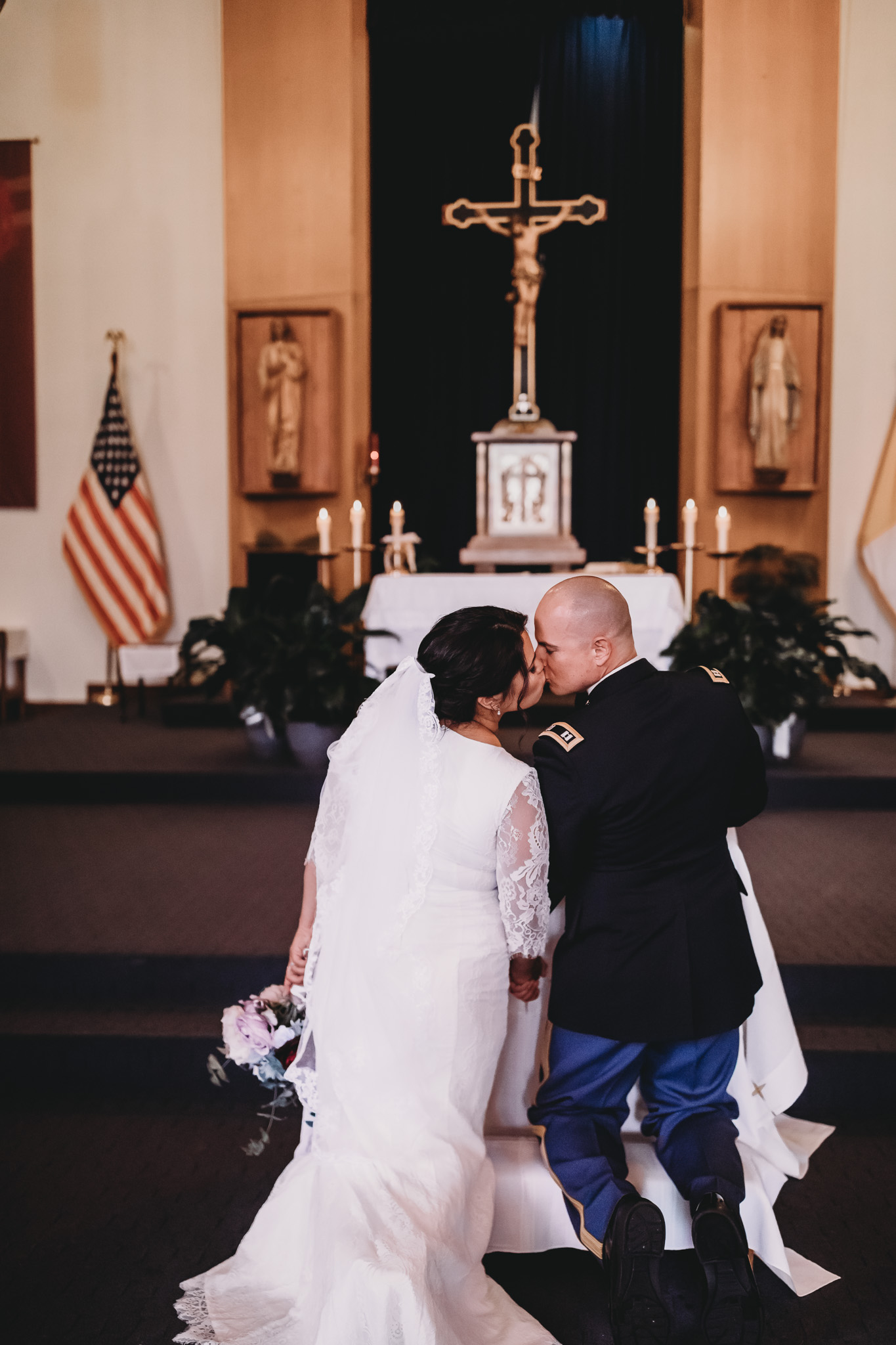Service Member and Bride Kissing at Alter